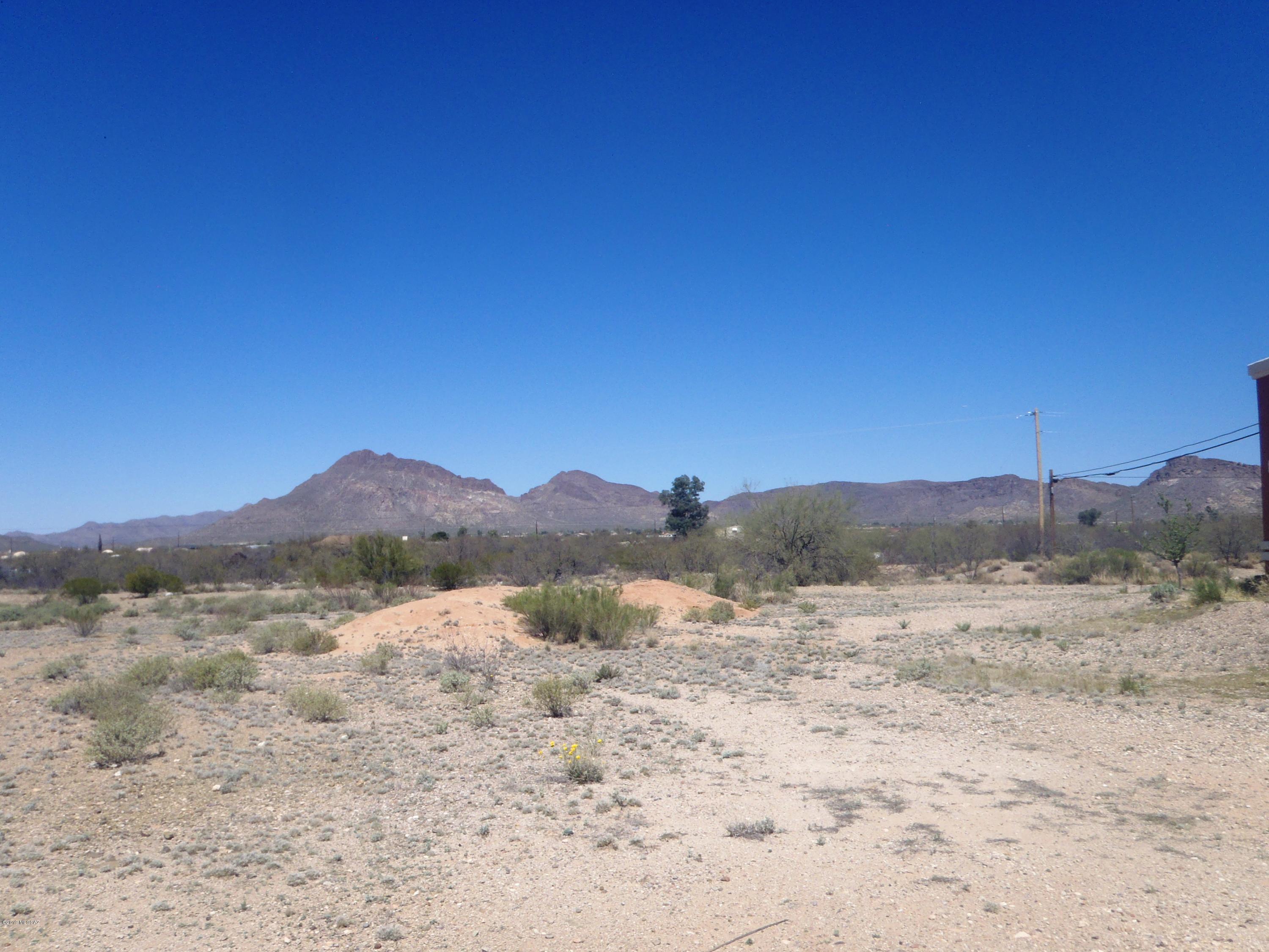 You'll love the location. minutes to downtown, the airport and freeway.   Enjoy the beautiful Mountain Views from your back Patio!  Ready to build.  Joint sewer line is already installed to reduce costs. Local Floodplain has remapped area.  All except tiny NW corner has been removed from floodplain.  Water Meter has been paid for, but not installed!!! Saves you $$$ Pima County has done special study to remove parcel from FEMA floodplain.  Application has been made to federal government for approval.