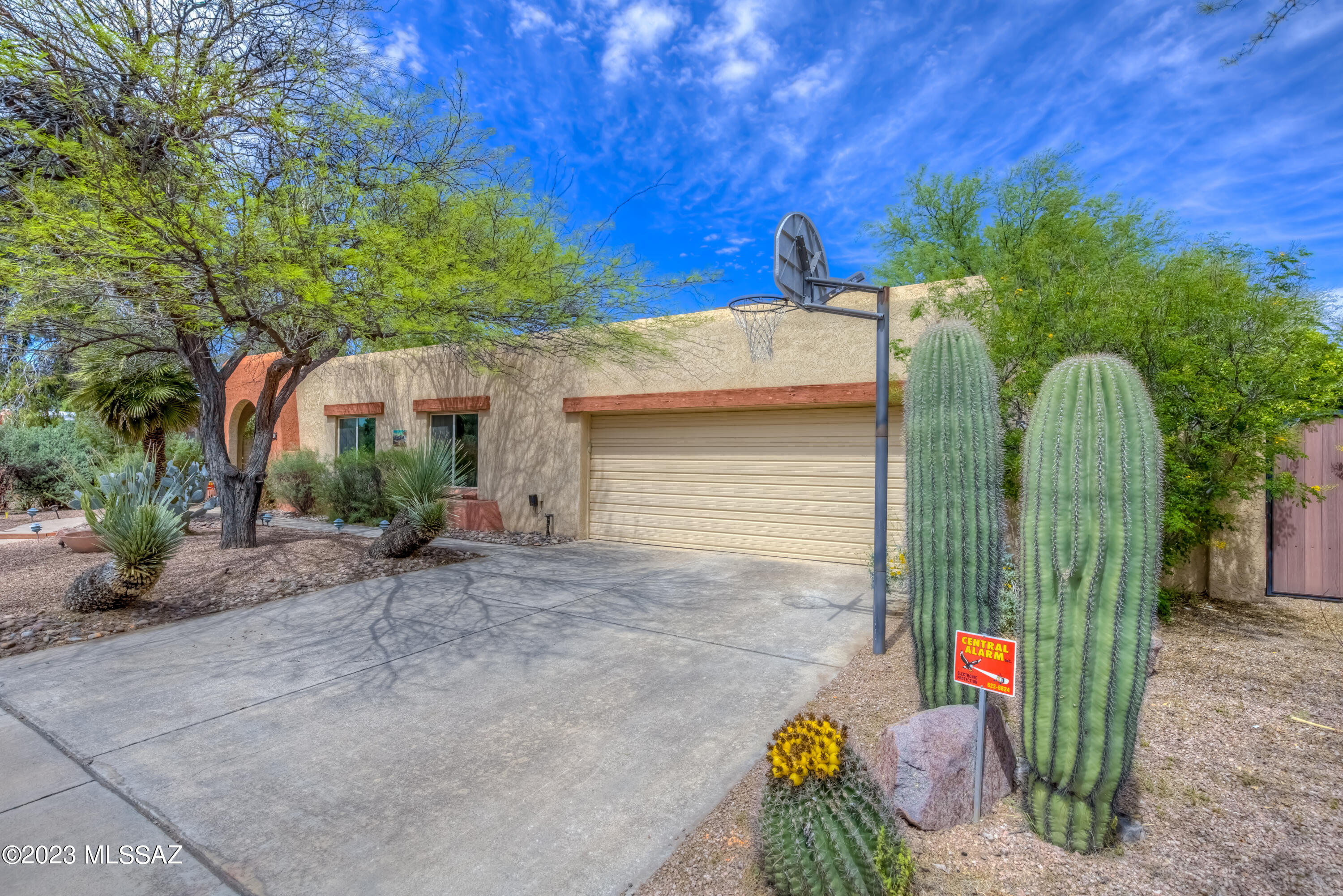 Welcome to this lovely east side home, tucked away in the private Vista del Rio neighborhood.  Featuring 1,919 sq.ft., 3 bedrooms, 2 bathrooms, Formal Living Room, Dining Room, Family Room with cozy beehive fireplace, 2-car garage, leased solar and a sparkling pool/above-ground spa, this home is sure to exceed your expectations!  This Tucson classic features beautiful Spanish porcelain tile, bright/open spaces and a generous Primary bedroom with en suite bathroom!  Venture out back to the north-facing rear yard with extended flagstone, refreshing pool with waterfall and relaxing above-ground spa!  Just minutes from shopping, dining, schools, medical facilities river path and recreational areas, this location is unbeatable!  Schedule your private tour today!