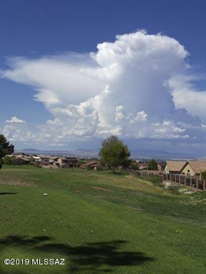 This golf cart path for the former Santa Rita Golf Course sports majestic views of the Santa Rita Mountains. This parcel is too small to build on, but it is one of the few legal and physical access points to the 34-acre Parcel 305-24-219A which is behind it! No RV parking! This parcel has never been part of the surrounding HOA.