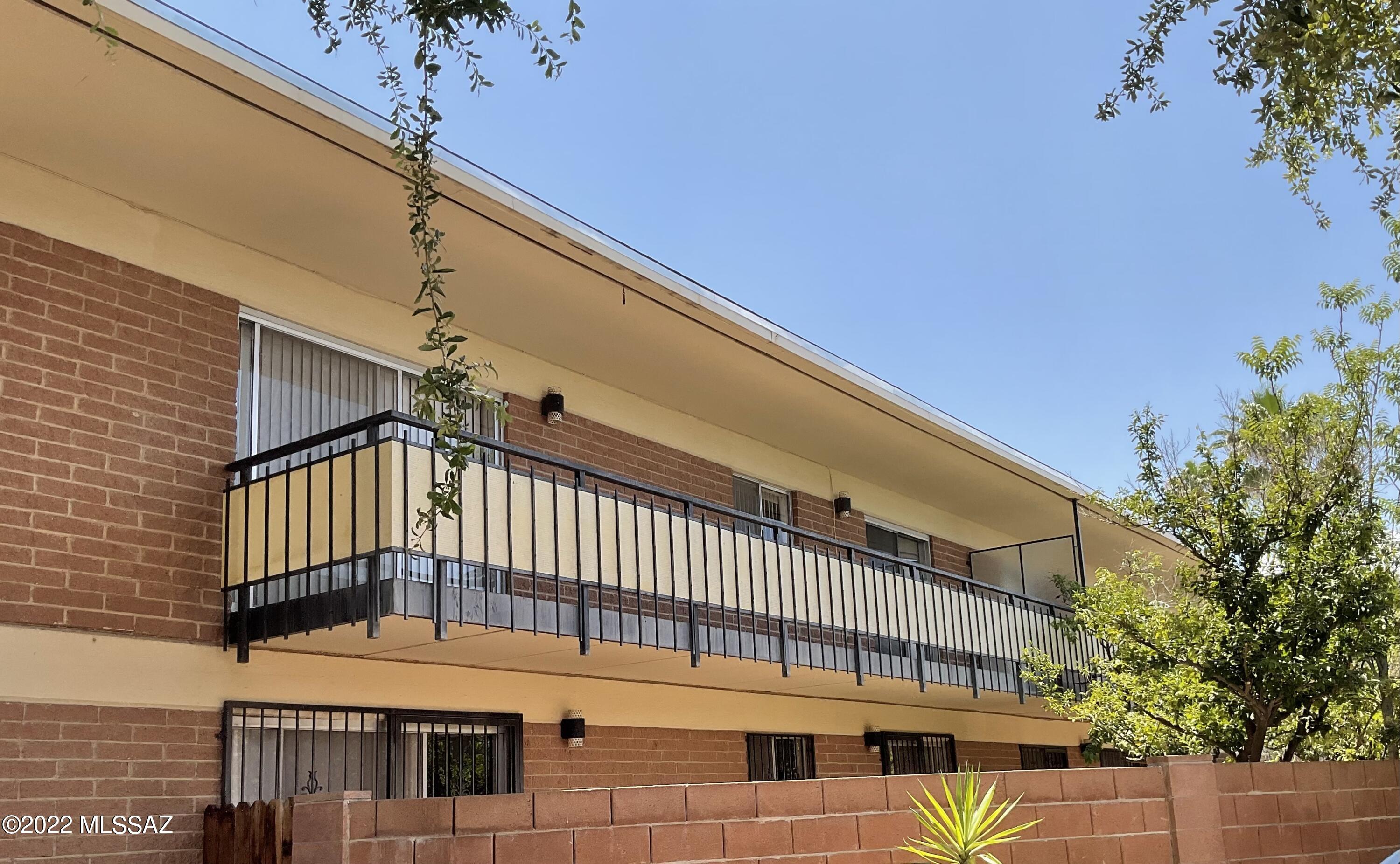 Newly installed laundry closet with brand new stackable W/D complete this 2bed/2bath 2nd floor condo.  A short walk to Reid Park, the zoo, a public golf course, shopping, & some of the most unique restaurants in Tucson, the location is less than 4 miles to the UA! Seller installed luxury plank vinyl in the living area in 2021 giving the room a spacious and updated look and feel; newer carpet in the bedrooms. The kitchen is complete w/ granite countertops, a cabinet pantry, seating at the peninsula & a view of the 20ft covered balcony w/ Catalina Mountain views to the north. Gas water heater installed 2020, AC unit 4 years old, new roof in 2022. Community pool and spa. Private laundry also located in the community. Shared garage space included in sale along with street parking.