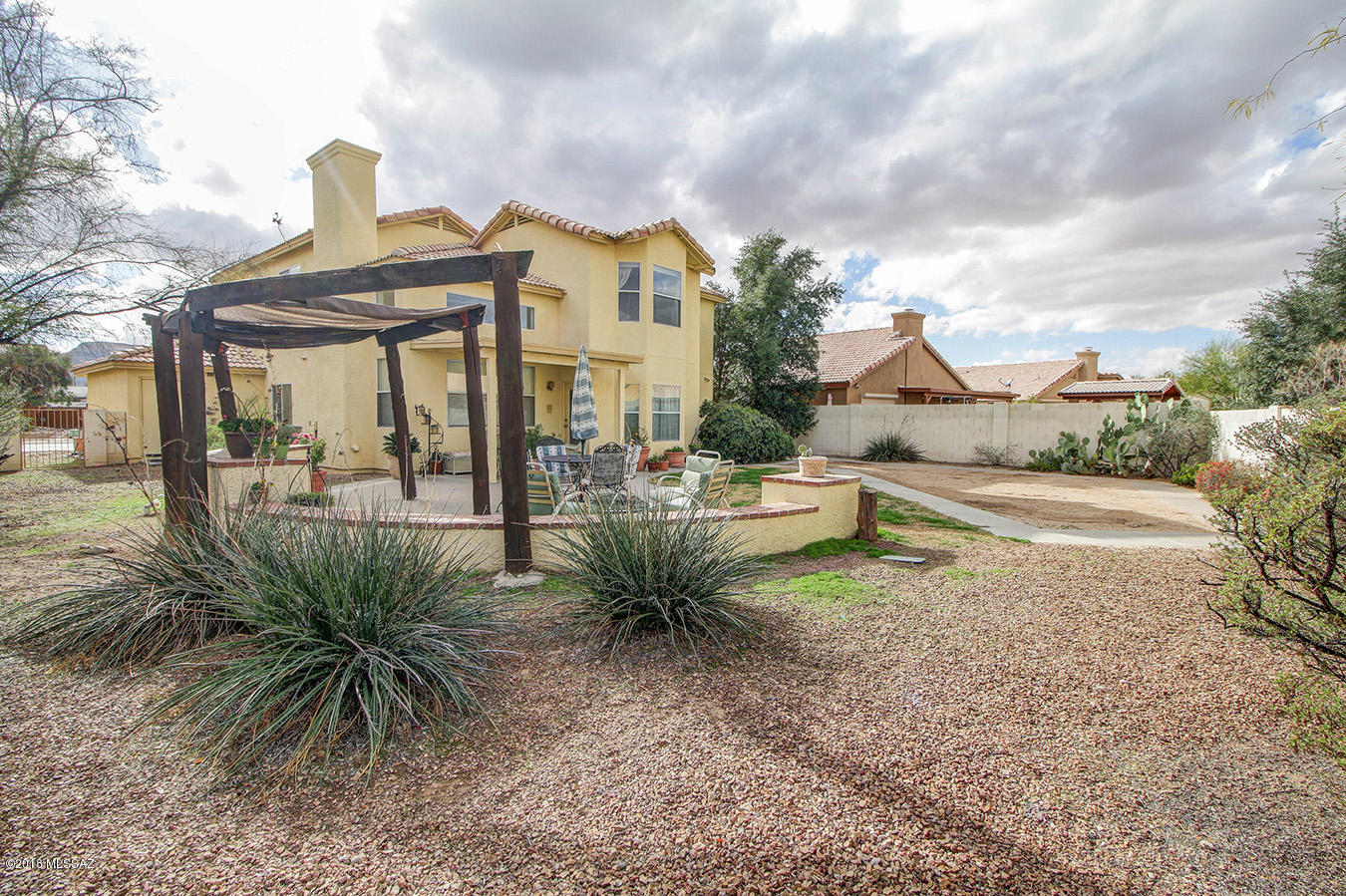 Former model home on huge cul de sac lot!  Special features include formal living & dining, soaring vaulted ceilings, family room off the kitchen with cozy fireplace & blt in cabinets/shelves, oak cabinets w/roll out shelves, spacious pantry, recessed lighting, 2 bay windows, ceiling fans, bedroom on the main level w/blt ins, walk in closet & pocket door to bathroom with shower, large master suite w/2 closets, m-bath w/luxurious garden tub & separate shower + dual sinks, under stairs storage, wood banister, smoke detectors replaced in 2016, A/C & water heater replaced in 2015, newer exterior paint, arched doorways, intercom, mature landscaping on irrigation, extended covered patio, blt in BBQ, 3 car garage, minutes to elementary school, pools, shopping, restaurants, skate park, + More!!!