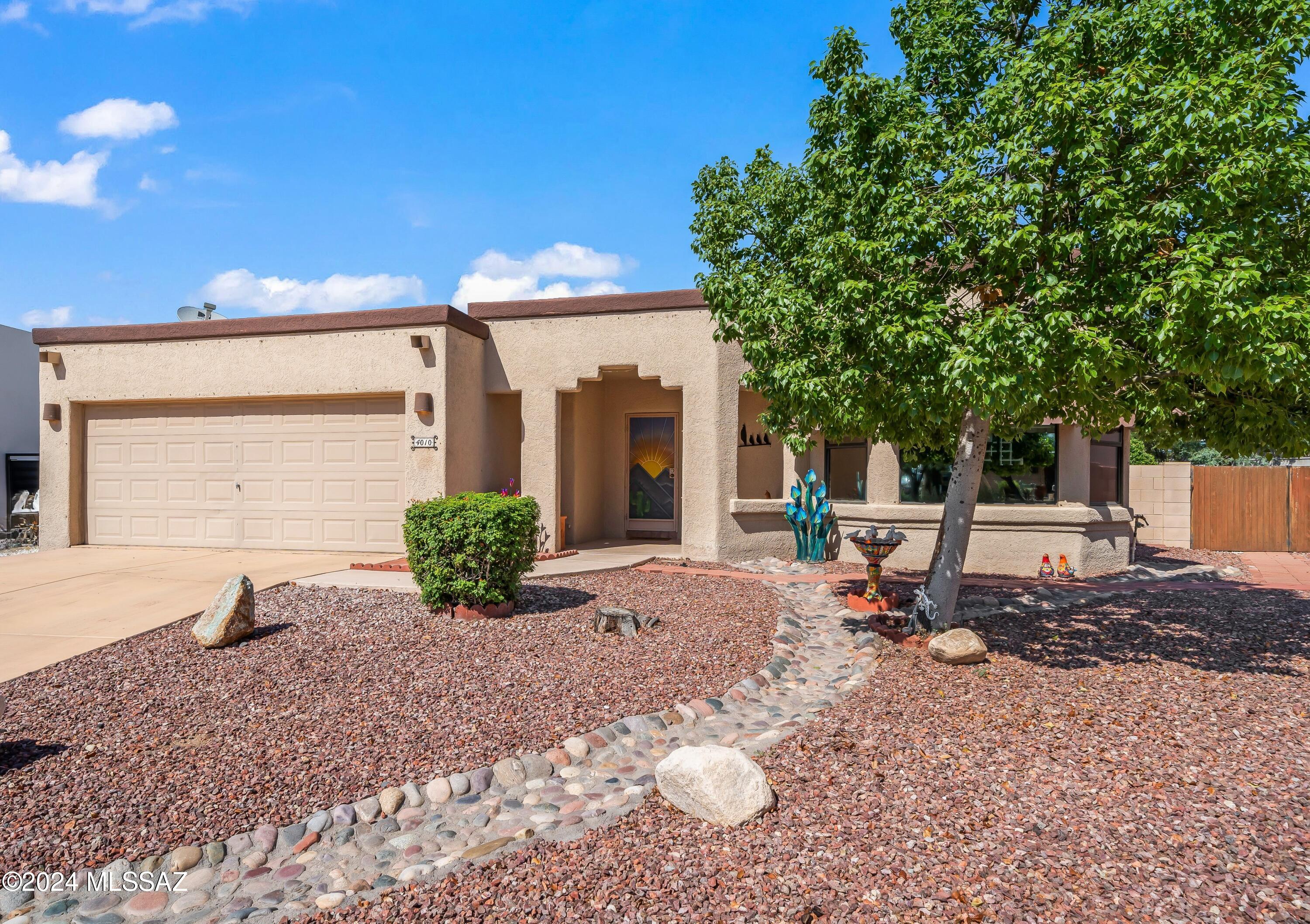 This SW Contemporary is offered by the original owner. No HOA! Brand New HVAC! Brand new garage door & motor! Brand new pool pump! This well-cared for home sits on a quiet cul-de-sac tucked into a tranquil neighborhood of custom & semi-custom homes. The 3 bd/2 ba offers an open floor plan with high ceilings and split bedrooms. The spacious living and separate dining rooms share a lovely 3-sided gas fireplace making it the centerpiece for cozy gatherings. Enjoy breakfast in the bright nook with large windows or at the breakfast bar, both designed to make mornings easy for everyone. Lots of useable cabinets and large pantry closet. A thoughtfully planned built-in desk for managing day to day details. The primary bedroom looks out to the sparkling pool. The spacious ensuite boasts separate shower, toilet room, & soaking tub with pot shelves. Enormous low-care backyard includes large covered patio, citrus trees, a double gate, & fountain. Convenient to all nearby shopping and amenities, easy access to I-10. Add your personal style and make this your forever home.
