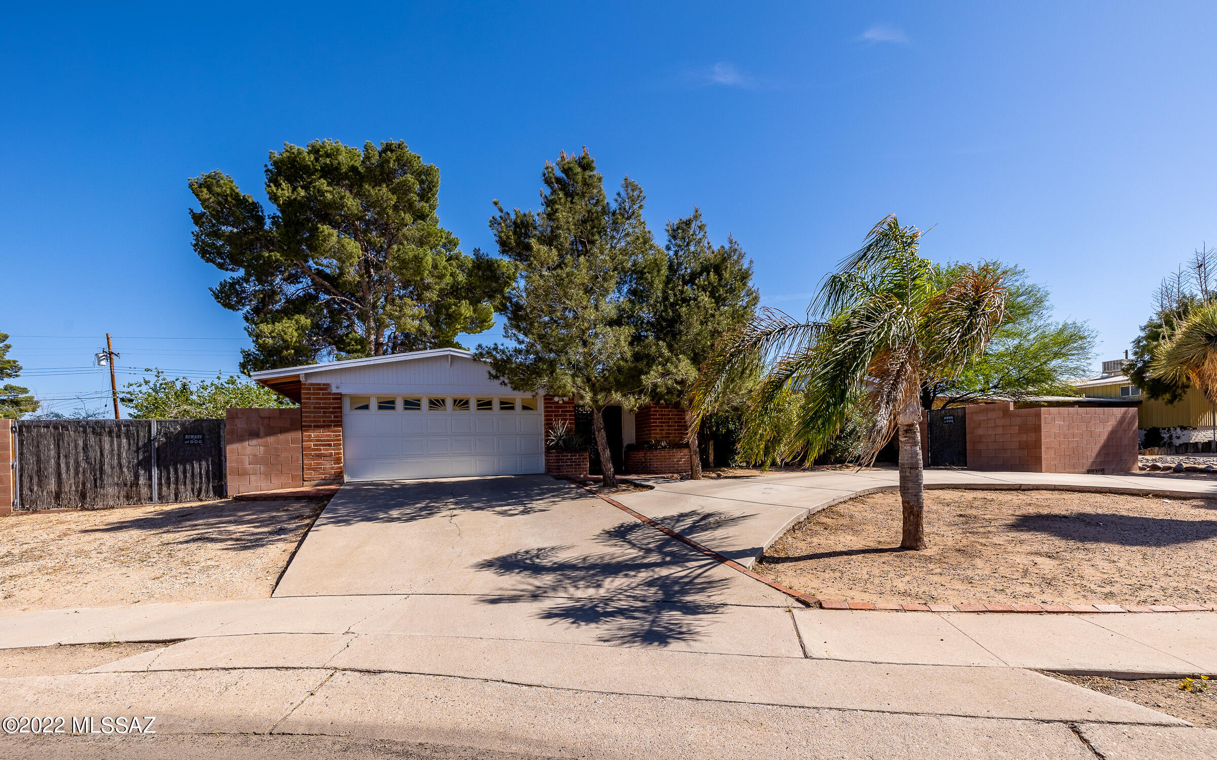 Single-story home on an over-sized cul-de-sac lot with a pool and plenty of yard space. NO HOA FEES! Enjoy the private front courtyard and separate backyard areas with fruit trees, shade trees, large workshop/shed and plenty of room for gardening or toys. Inside this 4 bedroom home has no carpeting, 3 full baths with separated family room with its own entrance den & bath. Multiple possibilities for this area that is currently a gameroom... could be guest or next gen quarters or even a separate apartment. RV gate and Whole House Backup GENERATOR! Super close to Jesse Owens Sports Park, Sprouts & other shopping/dining.