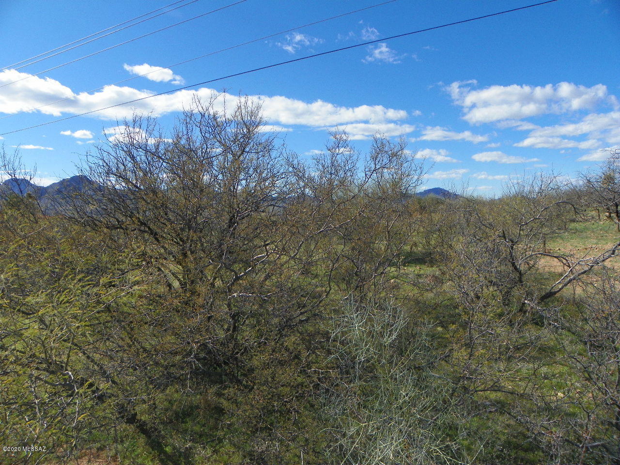 Residential lot with paved roads and great views.  Electric and water both appear to be at the street.  Water should be verified with water co.  Lot is flat and easy to build on.