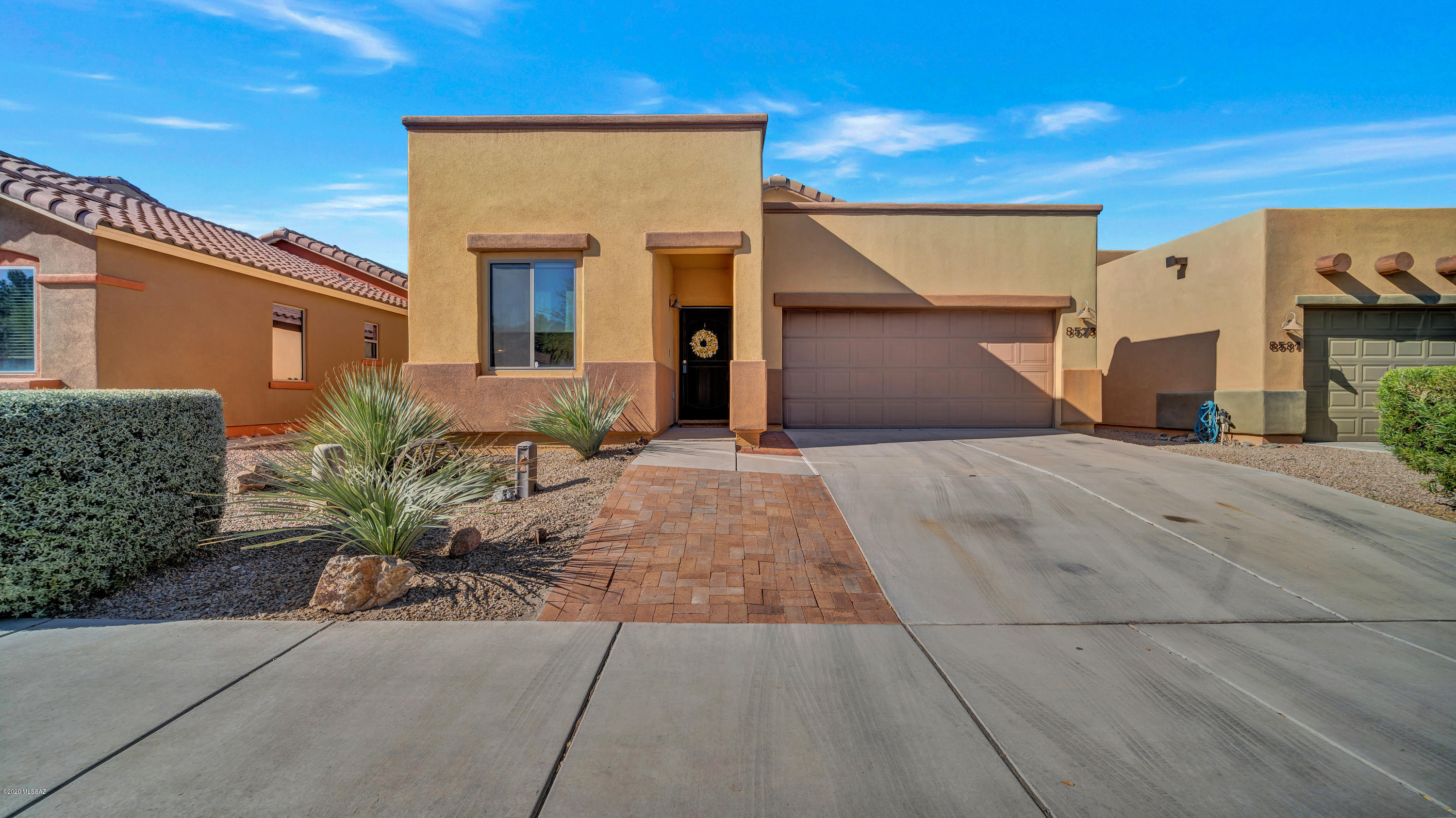 Beautiful Home in the Gated Pines Community! This 5 bedroom 2.5 bath home features spacious Family Room, Vaulted ceilings , oversized ceramic tile floors, Newly painted interior, new window treatments, laundry Room with storage shelves, and much more. Open Kitchen offers rich wood cabinets, stylish counters, coordinated appliances, and shelved pantry. Breakfast/Dining area just off the kitchen. Spacious Master Bedroom has walk-in closet. Backyard with covered patio and recently updated yard with fruit trees. Nearby community swimming pool is like having your own pool without the maintenance. Pool area also includes a large covered Ramada and play equipment. Close to I-10, shopping, restaurants and Tucson Premium Outlets.