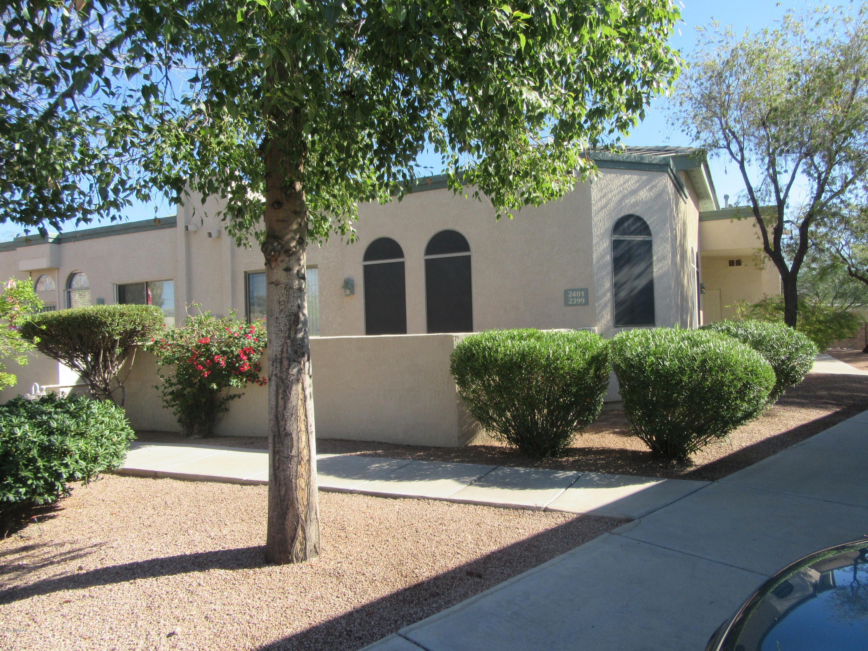 Age restricted beautifully maintained gated community in prime Northwest location! 2 bedrooms, 2 baths, nice north facing walled patio, 8 foot doorways, vaulted ceilings, bright and open! Newer stainless appliances including refrigerator. Gas stove. Dining area off kitchen near refrigerator. Newer washer and dryer included. No carpeting! Split bedroom plan. Community has pool, club house, easy walking access to Foothills Mall. Doggie Park across from entrance to community. Move in ready home is well cared for!