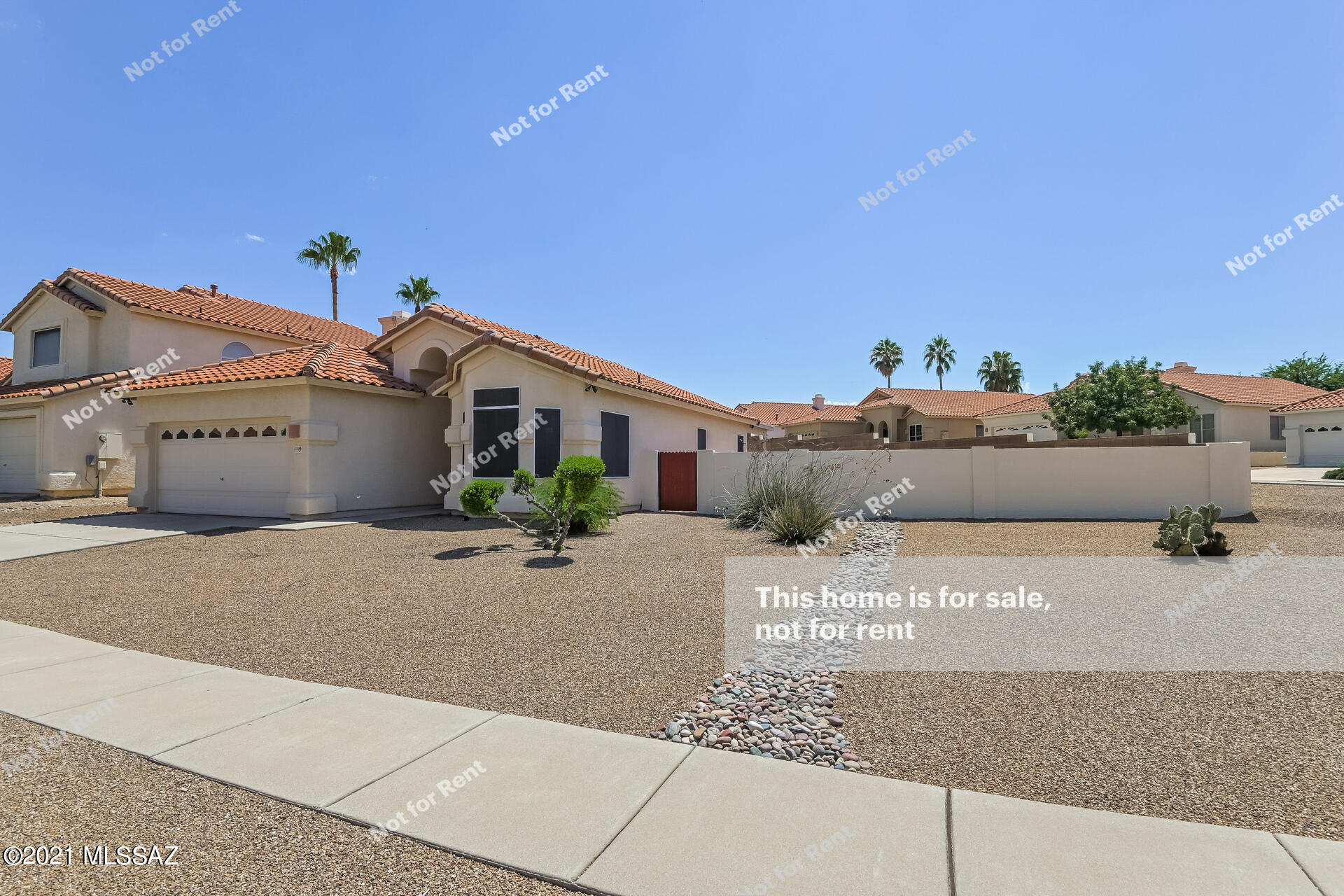 This Tucson one-story home offers granite countertops, and a two-car garage.