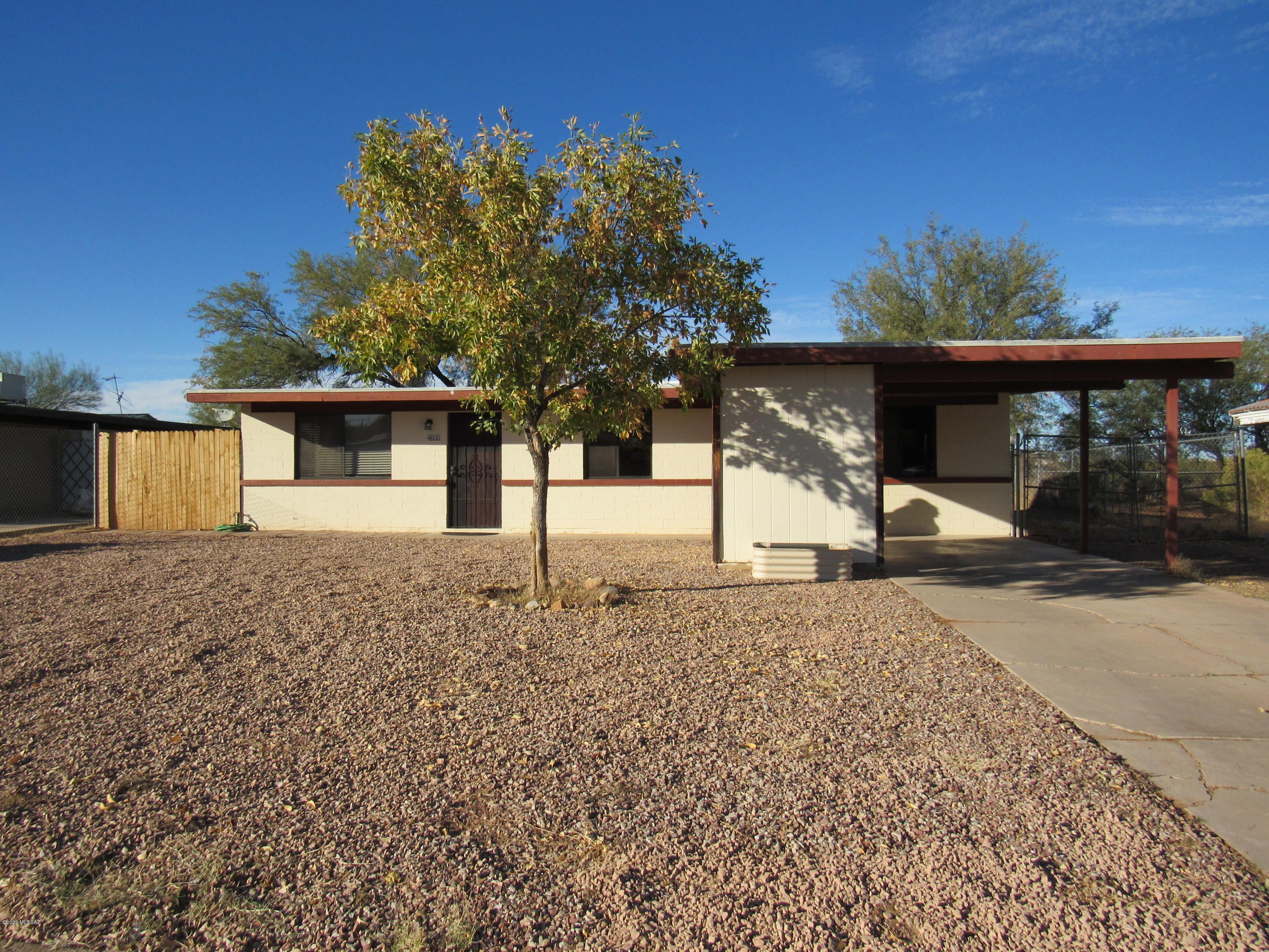 Welcome to Lakewood Estates! This cozy 3 bed/2 bath home is tucked away on just over a 1/4 acre of land in the quiet  community of Amado. The large eat-in kitchen which features an abundance of natural light, refinished cabinets, and updated appliances may easily become your family's favorite space to be together. Just outside the kitchen, the ample-sized fenced backyard has a playground, basketball hoop, and no rear neighbors. The mature mesquite trees help provide shade and frame the spectacular mountain views to the north. Both bathrooms have been nicely updated, and the carpet was installed earlier this year. The bonus room can be transformed into a home office, virtual learning space, or even a den. The established neighborhood has no HOA and is near Sopori Elementary. Welcome Home!