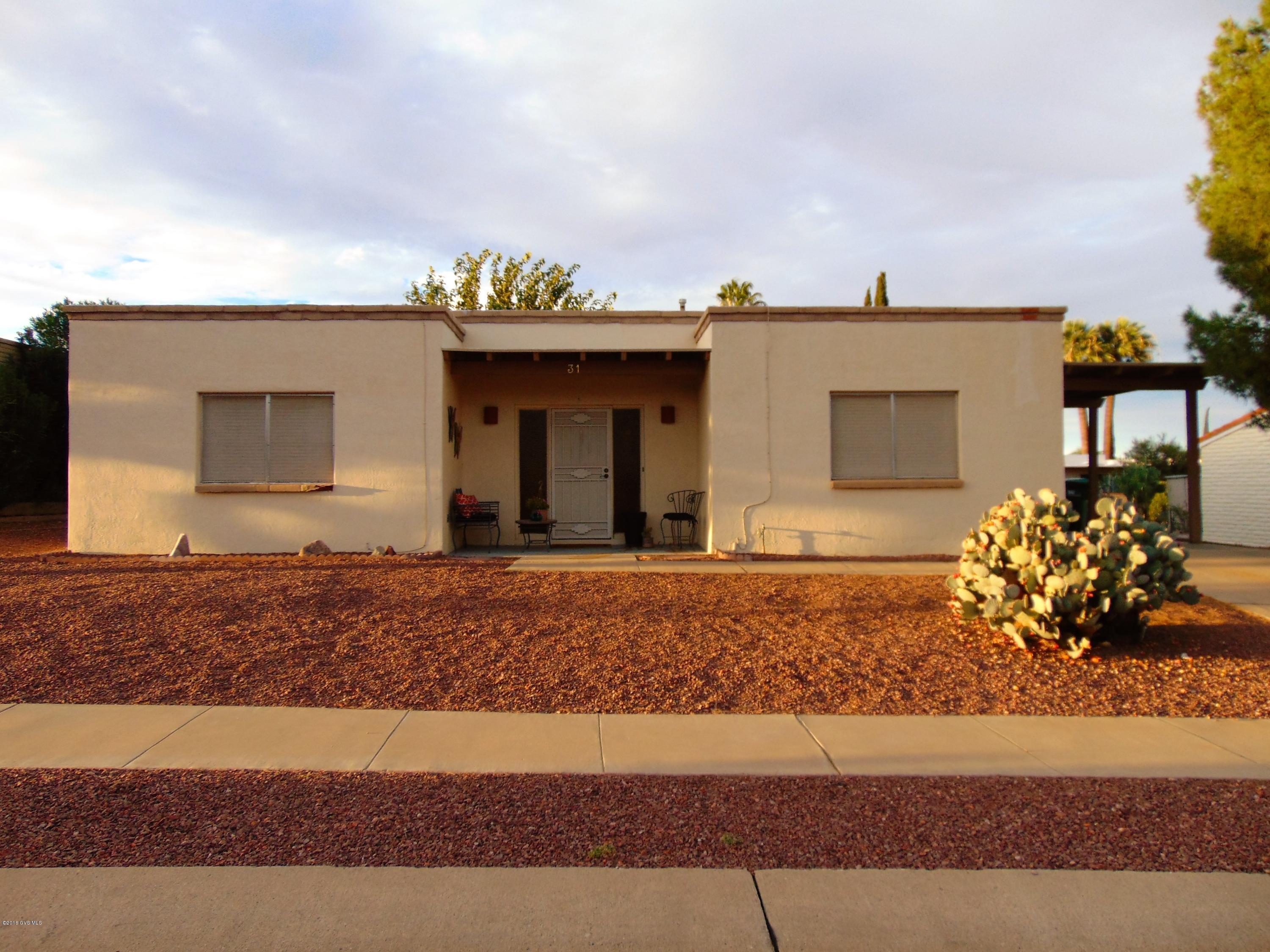 Darling 2 BD/2 BA Territorial style home in Desert Meadows. Good size living a room, generous kitchen with breakfast bar that opens to dining area. Kitchen desk. Updated bath vanities and mirrors on both bathrooms. Enclosed AZ room. Walled backyard is pet friendly. Perfect for year around or winter home. Green Valley Membership.