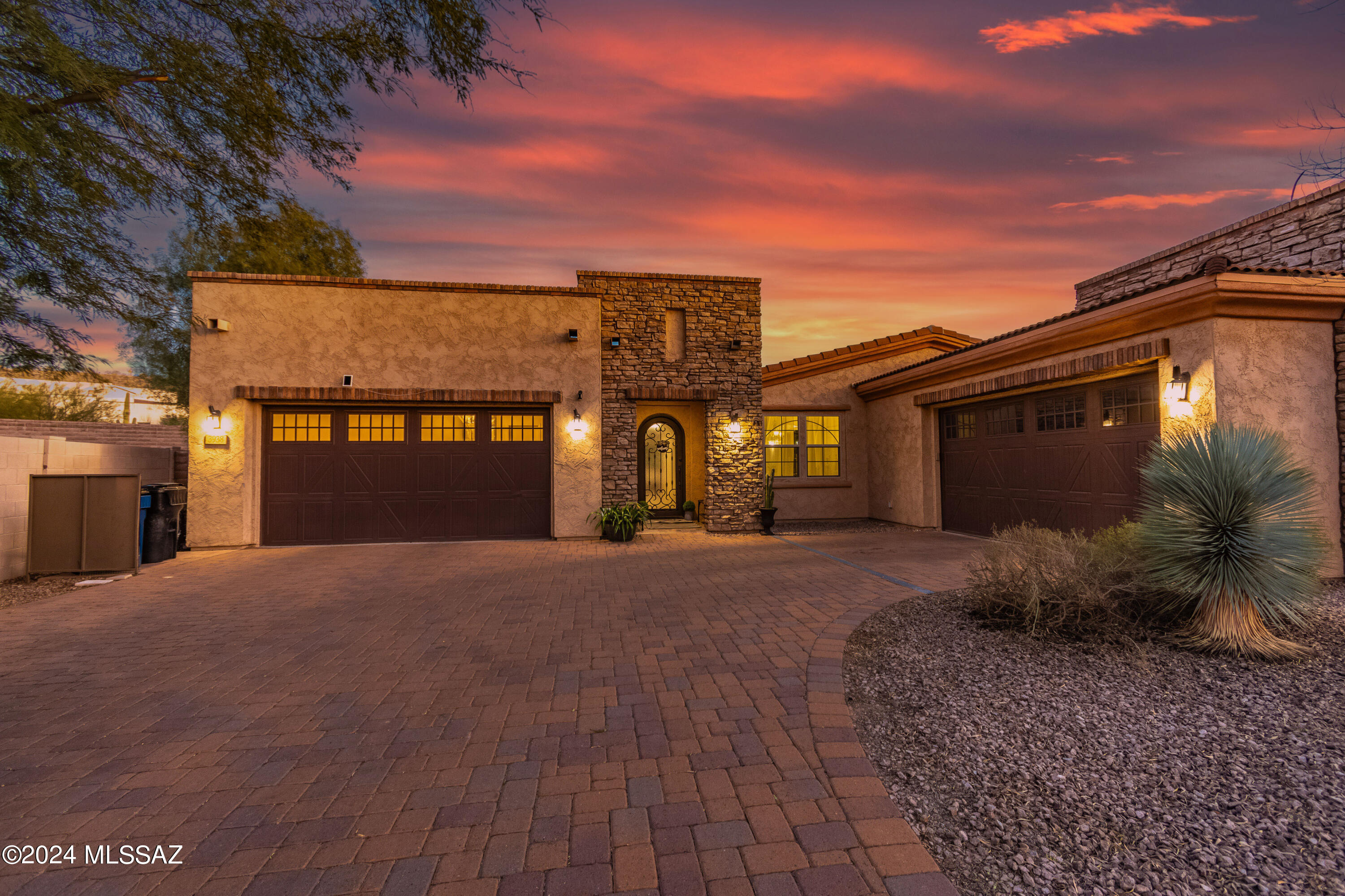 2014 Maracay Home, tucked away across from a park in a small gated community in the Catalina Foothills. 4 bedrooms, 3 full baths plus an office & separate den/game room - tastefully upgraded throughout. Expansive great room with soaring ceilings, impressive owner's suite, open kitchen with striking granite island & custom concrete tile backsplash. Situated on a large .37 acre lot, professionally landscaped with pavers, grass, mature trees, built-in grill - and a perfect little dog run. Large unimproved side yard can easily accommodate a luxury pool/spa. 4 fully insulated garages, wired with outlets for electric vehicles. Pre-wired for solar panels.