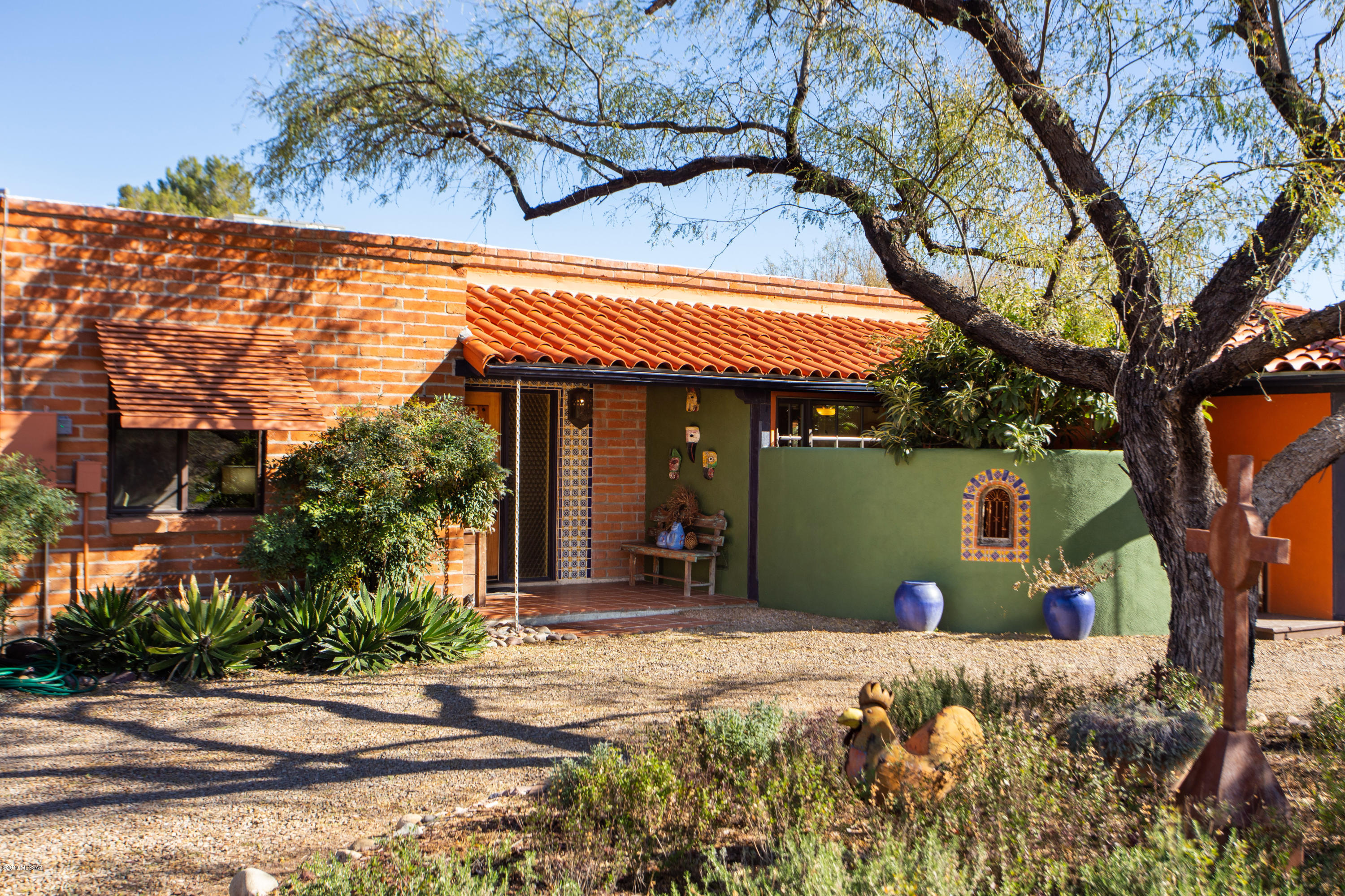 Built in 1972, this Territorial-style Adobe Brick  4 Bedroom, 2 bath home has a renovated Casita with a 1/2 bath. Thoughtful upgrades - all with respect for the integrity and character of the home - include all new top quality windows, interior and exterior doors, and tasteful Talavera tile work throughout. 
There's more: Newer HVAC and roof, New rusted steel garage doors, laundry room and two closets fully updated by California Closets. New stainless refrigerator and stainless washer and dryer included in sale, Pool restored 3 yrs ago including equipment, tile, and decking. The restored and updated Adobe brick Casita could be a Studio, Office, or....?
