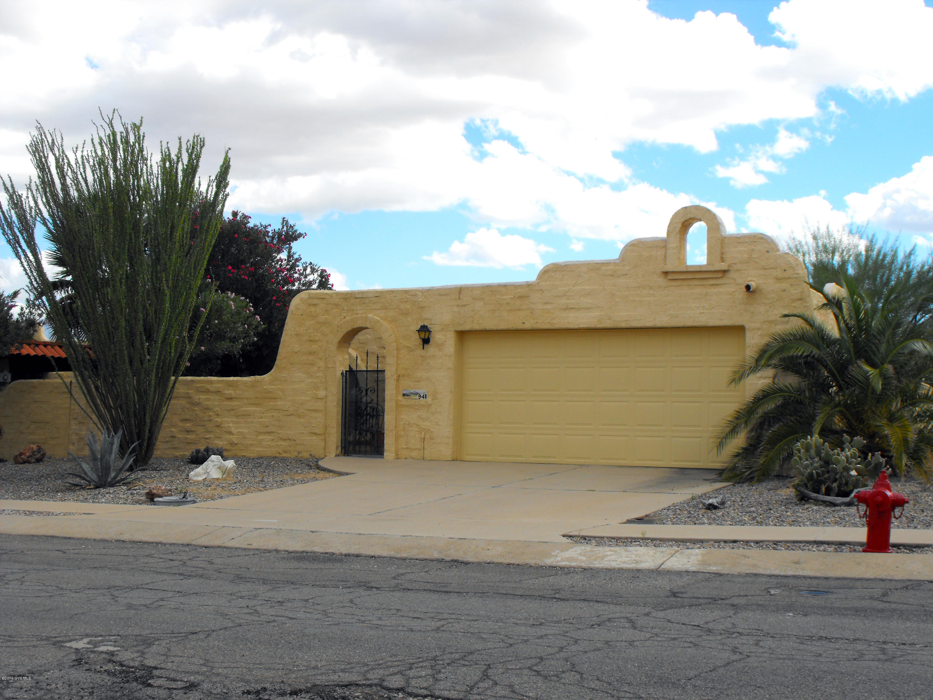 Pre-inspected and ready for new owners. This tastefully furnished townhome features a front courtyard, side patio plus a large covered patio. Updated bathrooms, ceramic tile throughout, walk-in closet, and more. Green Valley Recreation is optional.