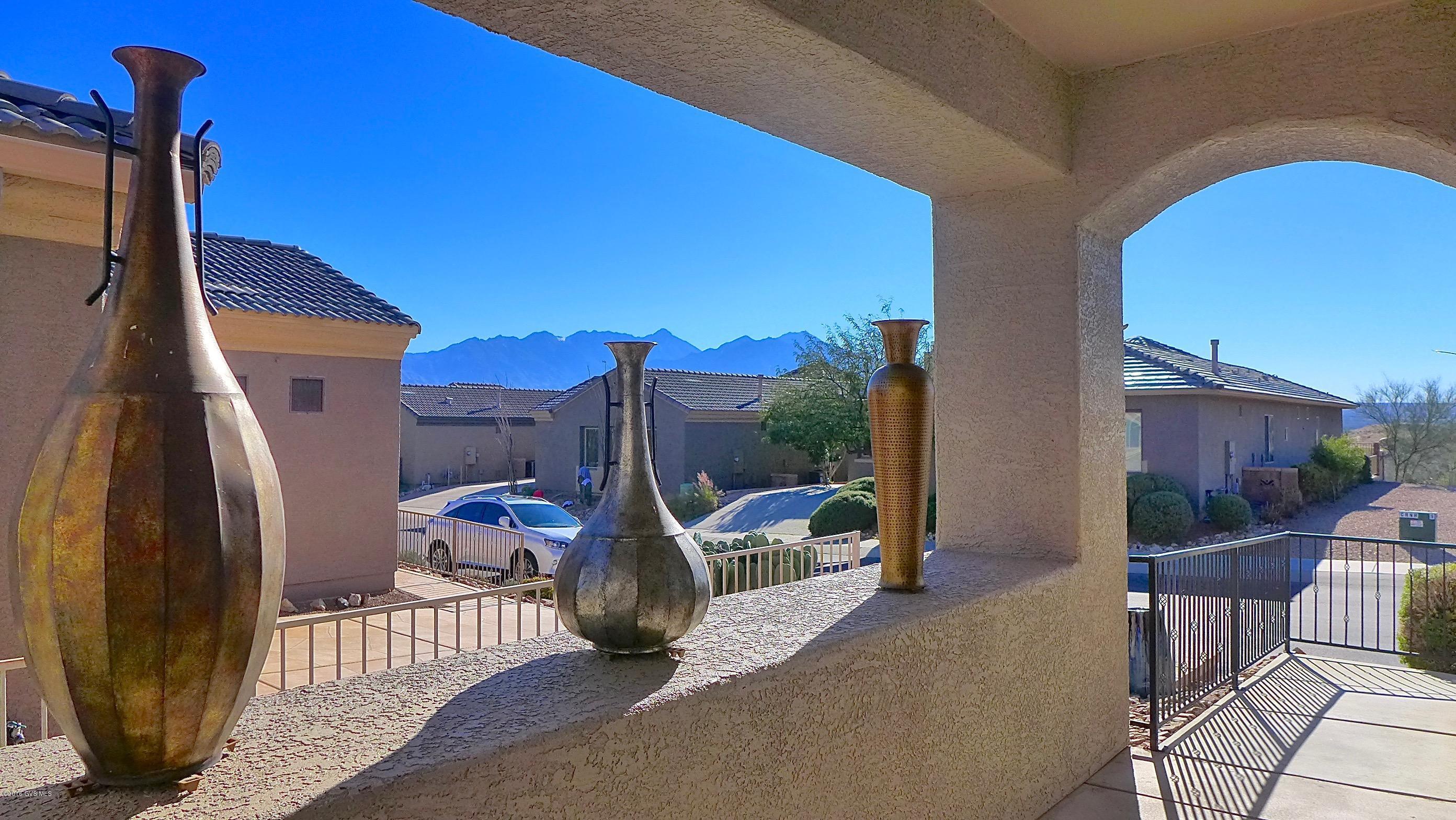 This popular Bonita floor has a 1BR, 1BA Casita with high-end upgrades & designer touches throughout. Even the most discriminating buyer will be impressed! Sitting high on bluff overlooking the Canoa Ranch golf course it offers mountain views from the Courtyard entrance and sweeping mountain vistas in back. Among its many features this home boasts beautiful tile floors throughout; and a kitchen with gorgeous high grade granite counters, dark wood cabinets, gas range and gleaming stainless steel appliances. The 2.5 car garage has a workshop and the 1 BR, 1 BA Casita makes not only an outstanding studio as it is currently being used, but also very private quarters that your overnight guests will appreciate. If you like what you see most of the furniture & furnishings are available SBOS.
