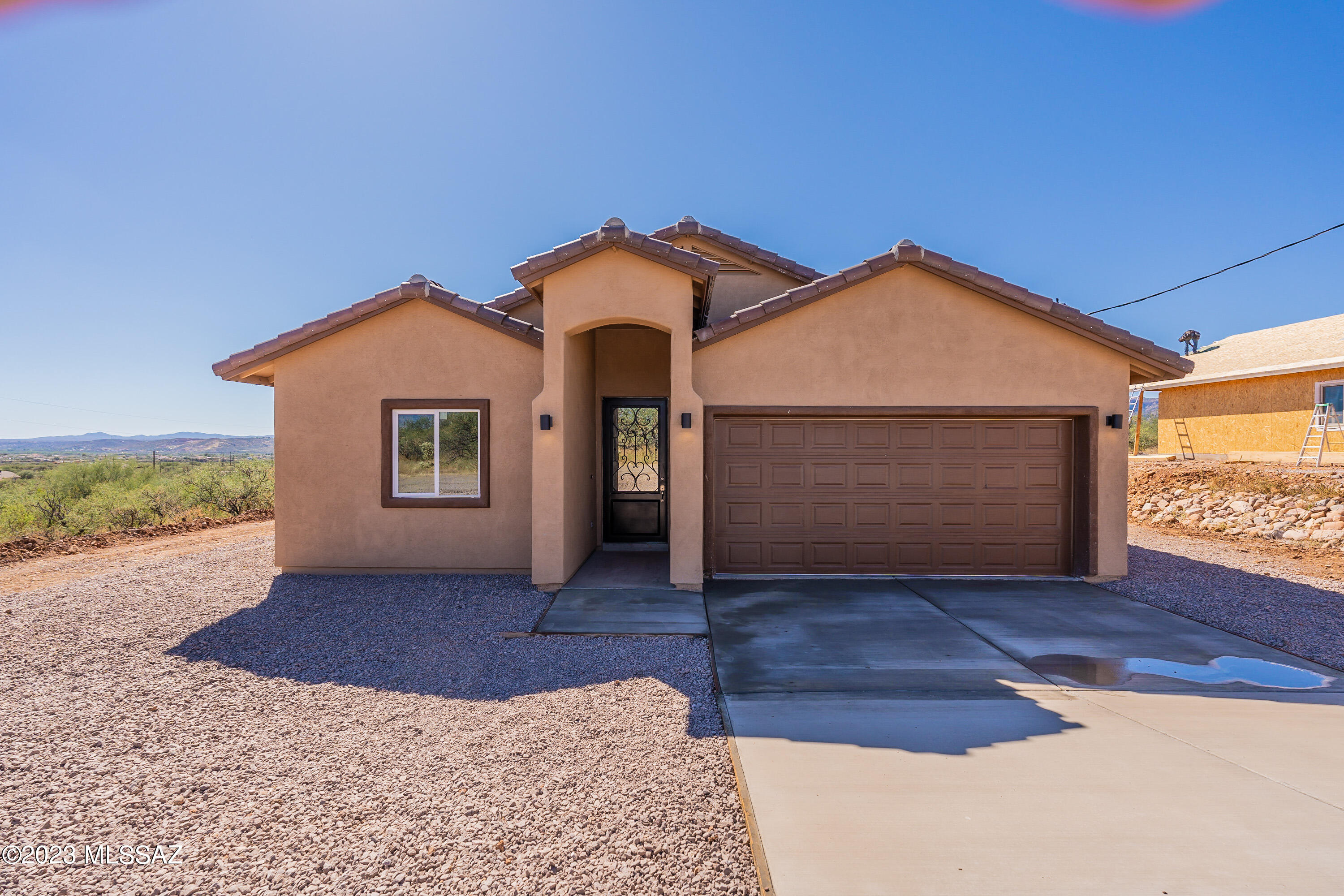 NOW READY! 
A Beautiful 3 bedroom 2 bath new build in Rio Rico, sitting on approximately a 1/4 acre. Home features granite counter tops, ceramic tile throughout, white cabinets, vaulted ceilings with ceiling fans. The property also has a vented attic and insulated 2 car garage! Gorgeous mountain views. Room for RV and/or other outdoor recreational toys!