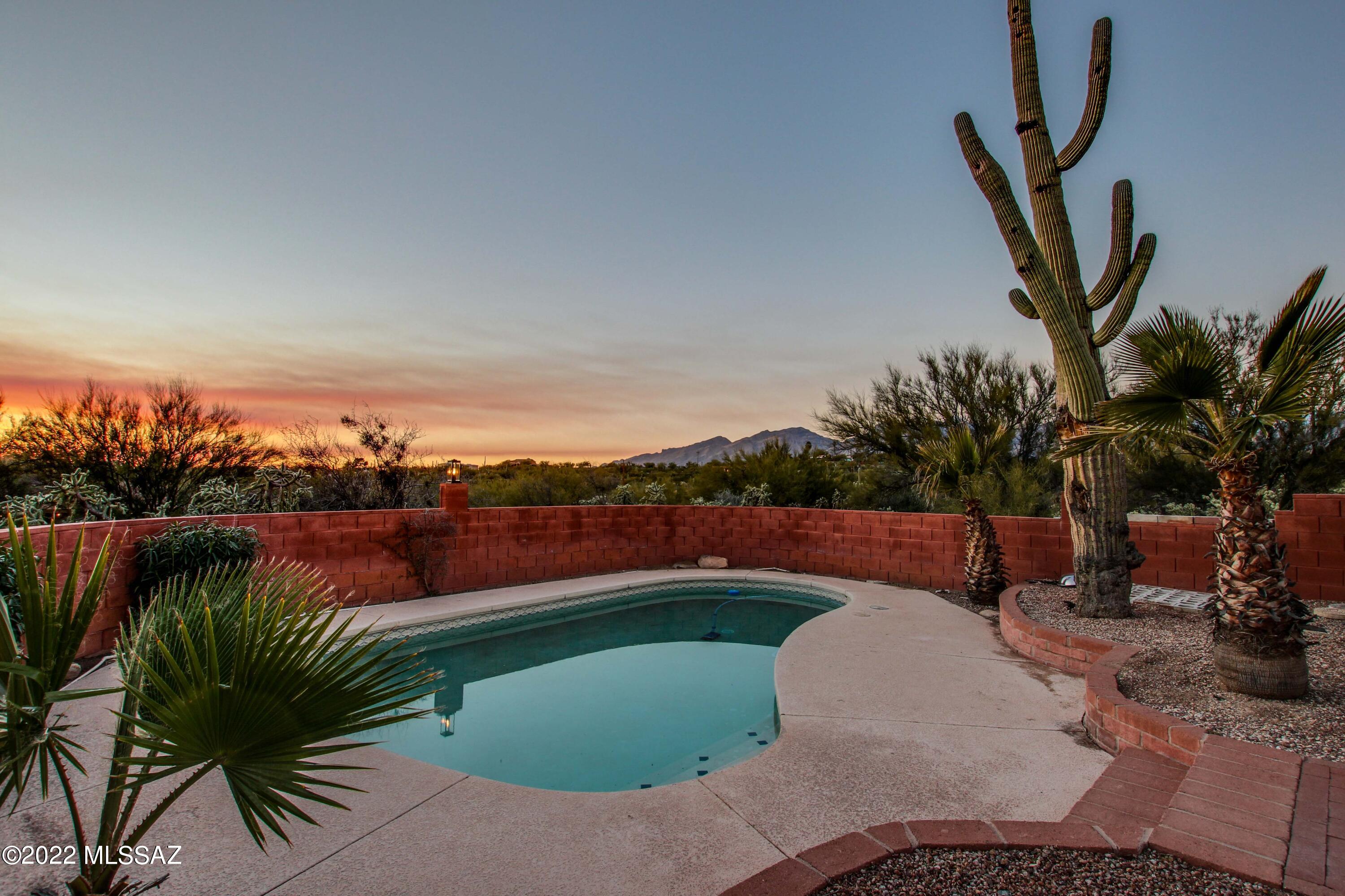 Welcome to classic Tanque Verde living! This 3 bed, 2.5 bath home is situated on over 4 acres of natural desert with a full guest house, 2 car garage and pool. Beautiful exposed beam ceilings are accented by the saltillo tile throughout most of the home. The large master suite includes a wood burning fire place with direct patio access. The guest house contains a full kitchen and bathroom and is currently being rented, offering you the opportunity for additional income! Don't miss your chance, take a look today!