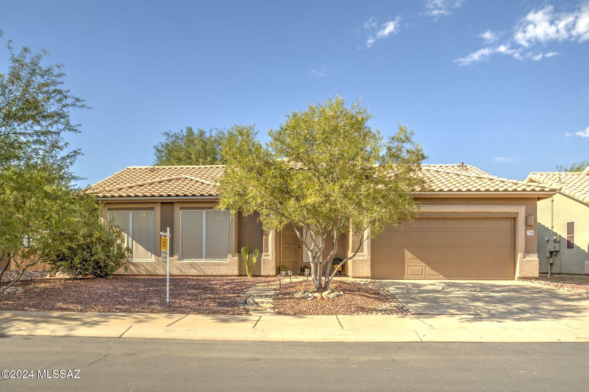 Tucked away in a peaceful corner of a Continental Ranch neighborhood is this light and bright 3-bd, 2-ba home. The backyard is situated next to a serene wash with peek-a-boo mountain views. Enjoy the benefits of a newer A/C (2022) and roof (2024), providing peace of mind and energy efficiency. The split-floor plan flows seamlessly to a low-maintenance backyard with a covered patio and pavers, perfect for entertaining under the shade of a mature mesquite tree and beside a citrus tree. Exterior paint in 2021 and new custom window screens in 2021. Soffits sealed with wire in 2023. Close enough to walk to, far enough to feel the quiet from walking paths, the famous Tucson Loop, and within walking distance to the Continental Ranch Community Park which offers horseshoe pits, soccer fields, tennis courts, and a skate park. Plus, enjoy easy access to 2 community pools (one is right across Coachline), splash pads, shopping, restaurants, I-10, and the outlet mall. With a 2-car garage and laundry room, this home combines comfort and convenience in a vibrant community. See why so many people love to call Continental Ranch home!