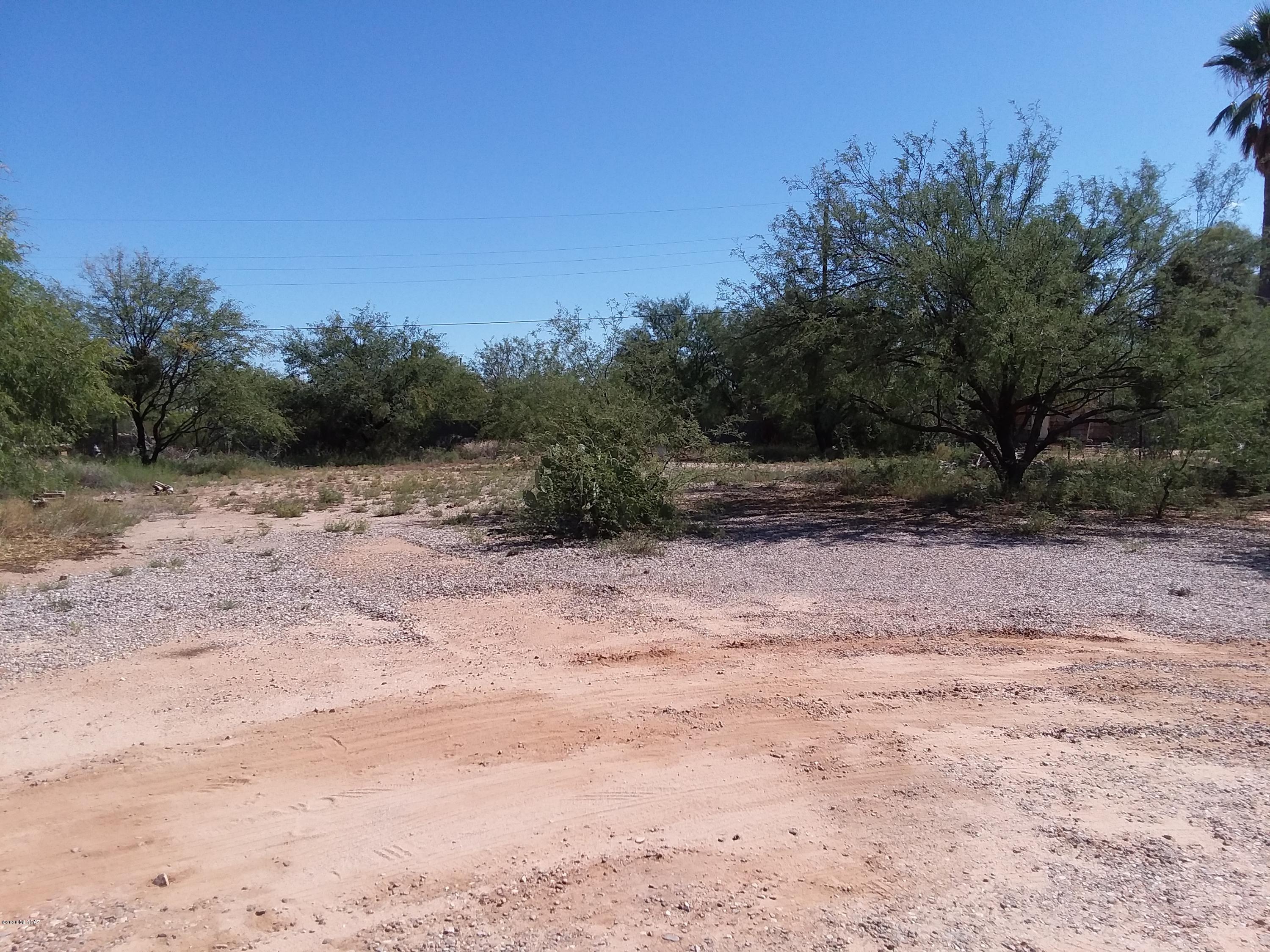 Great 1/4 acre piece of property that is fenced on three side with paved roads. Electric, Water and Septic already on property and ready to go for manufactured home.