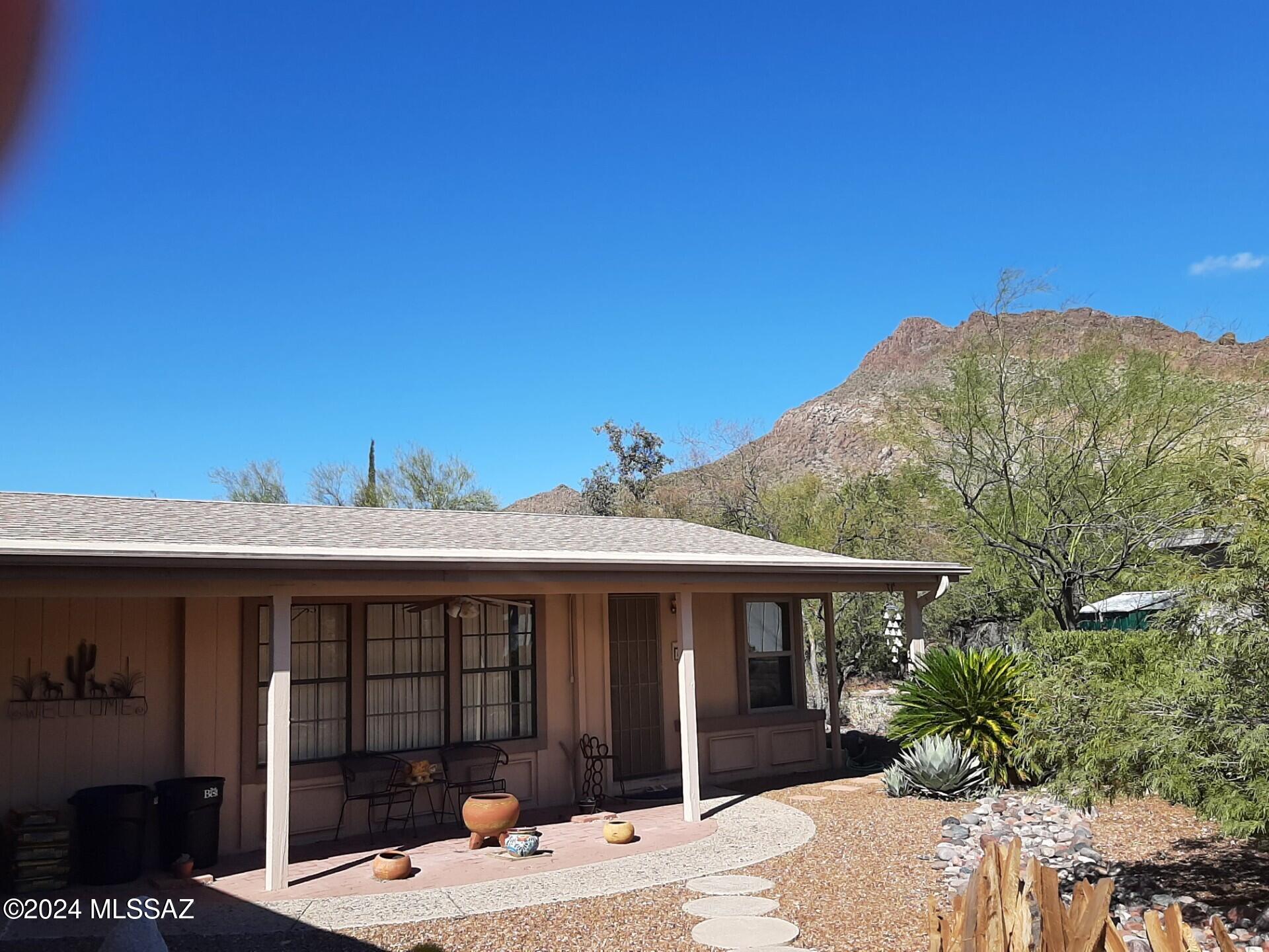 Enjoy great mountain views,gorgeous sunrises/ sunsets from this 1564 sq/ft home located on a quiet park-like cul-de-sac in Tucson Estates foothills. This 2br/2ba has all of the amenities. Electric shutters in AZ room & kitchen, solar tubes in baths for natural light, covered rear deck with marvelous views, storage and work areas in 2-car garage, bricked front patio with ceiling fan,