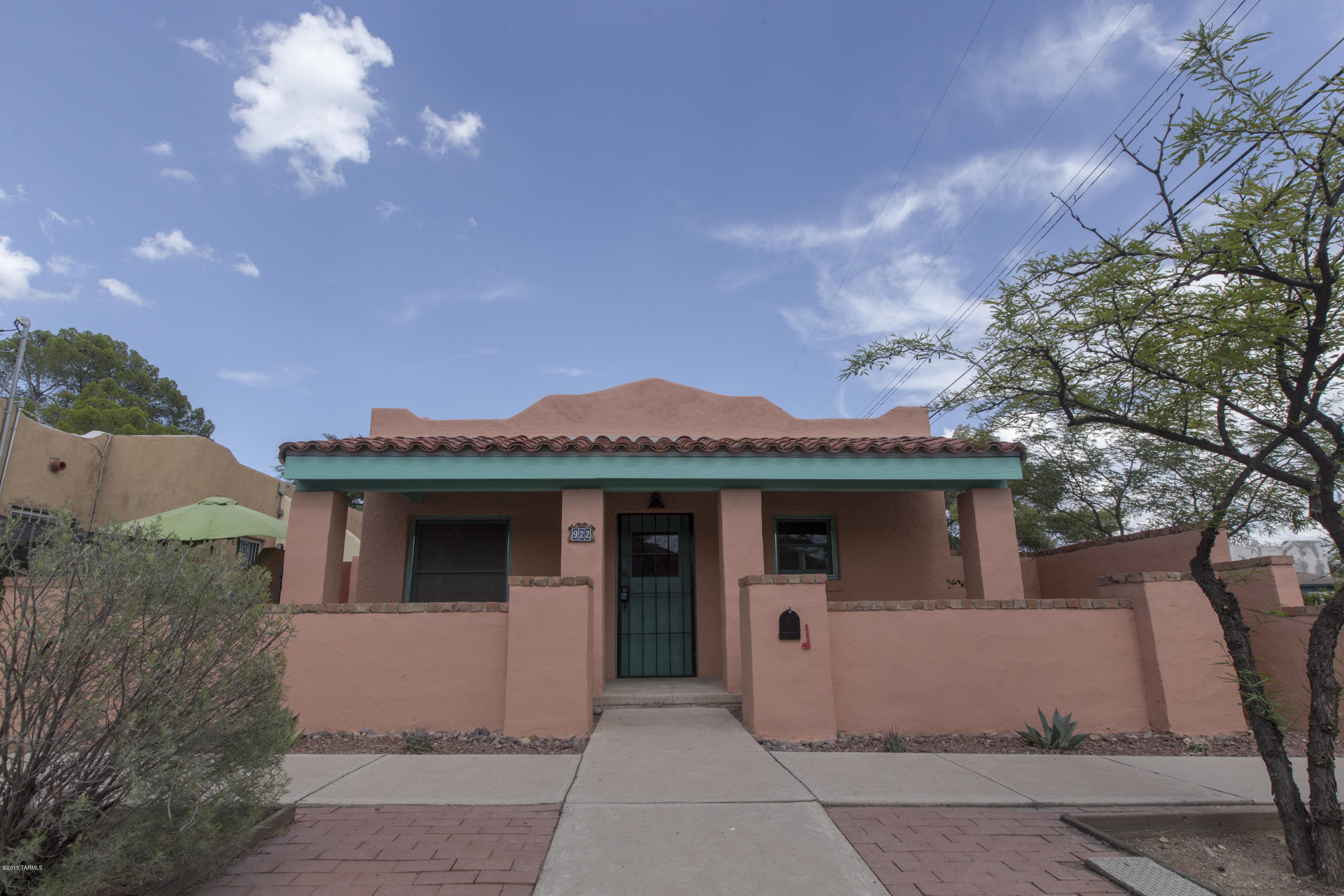 This 1926 Sam Hughes charmer has been completely updated and is move-in ready!! Only 3 blocks to U of A. Two Fireplaces, Saltillo tile and red oak wood floors throughout. The kitchen has granite counters with a new sink, faucet, dishwasher and microwave. The main bathroom has been completely renovated with ceramic tile, new fixtures and a skylight. M/B has French doors that leads to a lush backyard. Enjoy the shady flagstone patio and a wooden deck. It is a perfect place for entertaining! The charming guest house beyond the patio has a brand new kitchenette with sink, refrigerator, microwave, 3/4 bath and is heated and cooled. New window coverings, polished and sealed floors, new interior and exterior paint. A two year roof warranty. 3 Parking Permits are assigned to the property.Come see!