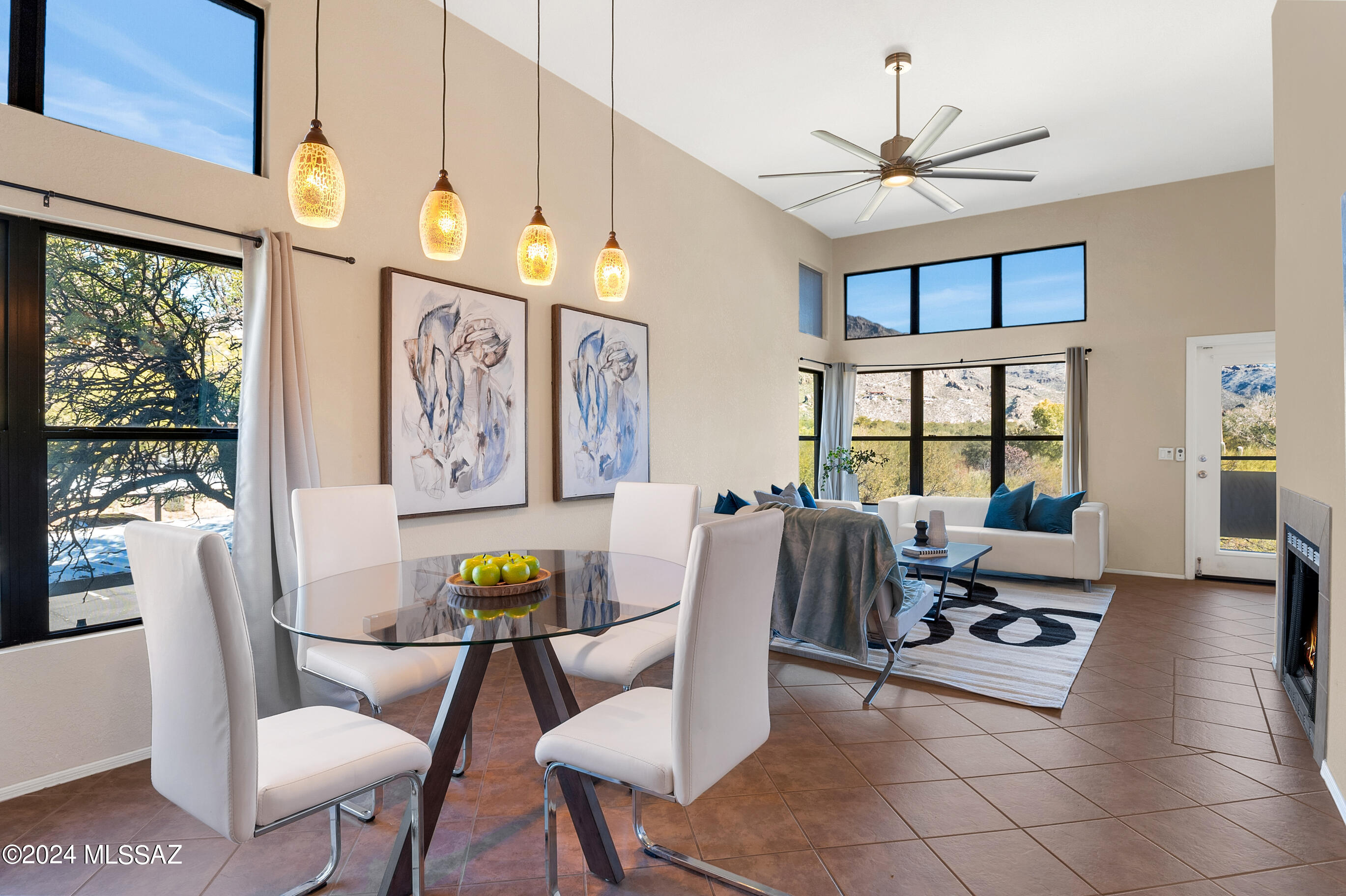 Experience breathtaking mountain views from this exceptional corner end unit located in The Greens at Ventana Canyon. This rare find features a split bedroom plan, a kitchen adorned with Corian countertops, cathedral ceilings, and elegant tile and laminate hardwood floors throughout. The great room boasts a wood-burning fireplace and dual-pane windows that frame the stunning mountains views. Enjoy the amenities of three swimming pools, a spa, athletic facility, and scenic walking trails within the community. New roof January 2024 and New AC August 2021. Conveniently located near Ventana Canyon, Sabino Canyon, grocery shopping, and restaurants. Your ideal property awaits.