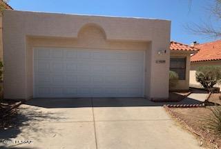 INSPECT property prior to offer. Fix Up. Cozy 2 bdrm, 2 bath home w garage. Backs up to wash for privacy. Needs TLC
