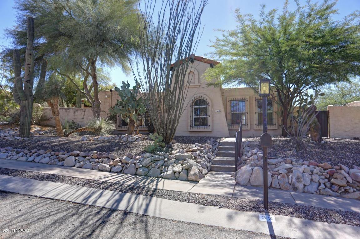 Light and bright large 3 bedroom townhouse with Saltillo tile, lots of windows, a spacious living room/great room/dining room, breakfast area, with a fireplace in living room, and master bedroom as well. Southwestern touches throughout, plus an atrium, bringing in more light to this charming home. You will love the large and private yard. All this, located on a quiet cut-de-sac, with easy access to downtown, U of A, Pima West Community College, and the I-10 corridor.