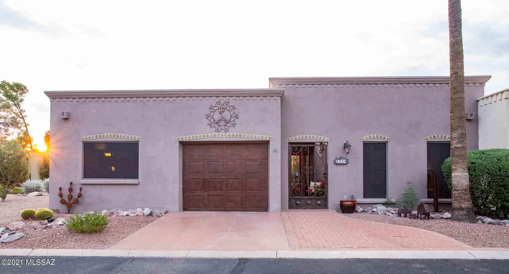 Beautiful home with upgrades galore overlooking the 14th fairway of the Catalina golf course of OMNI Tucson National, the host course for the PGA TOUR Champions Tucson Cologuard Classic. Located in secure, gated community with pool & spa! Low carbon footprint. Owned Solar system. With 1874 sq ft of living space this open floor plan home has 3 bedrooms, 2 bathrooms, spacious gourmet kitchen with plenty of cabinet space, stainless steel appliances, granite counter tops & beautiful back splash. Tile flooring throughout. Primary bathroom has dual sinks, walk in closet, & jacuzzi tub great for relaxing. You'll love the cozy backyard with golf course views, large covered patio, built-in BBQ, pavers, water feature, & mature landscaping, making this backyard great for relaxing & entertaining. Primary bedroom with wall fireplace, barn door, & upgraded ceiling fan. No age restrictions. Call Agent to see this home today!
