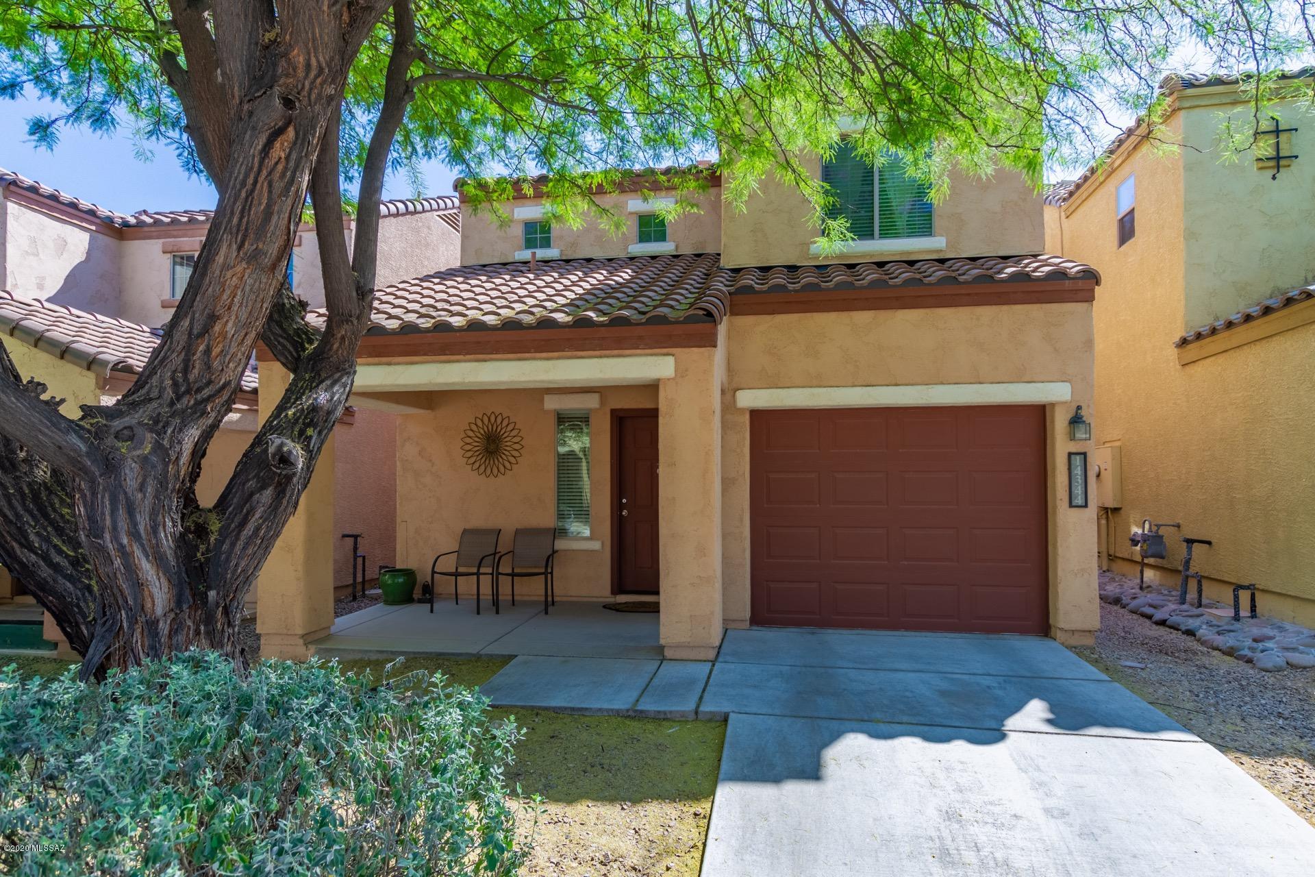 Dont miss this incredible two story 2 bedroom/2.5 bathroom home available in amazing Rancho Sahuarita. This beautiful lake community offers excellent amenities including a pool, parks, workout facility, sports courts, a splash pad, rec center, and more. Step inside to find a spacious, open concept living area with gleaming tile flooring and neutral paint tones. Kitchen is complete with gas cooking, coordinating white appliances and crisp white cabinetry. Powder room downstairs. Bedrooms are upstairs for privacy. The master retreat includes a walk-in closet and a private en-suite. Large, low maintenance backyard features a covered patio and is fully enclosed with block fencing, a perfect spot to host a bbq or relax after along day. This gem has it all. Call to schedule your showing today.