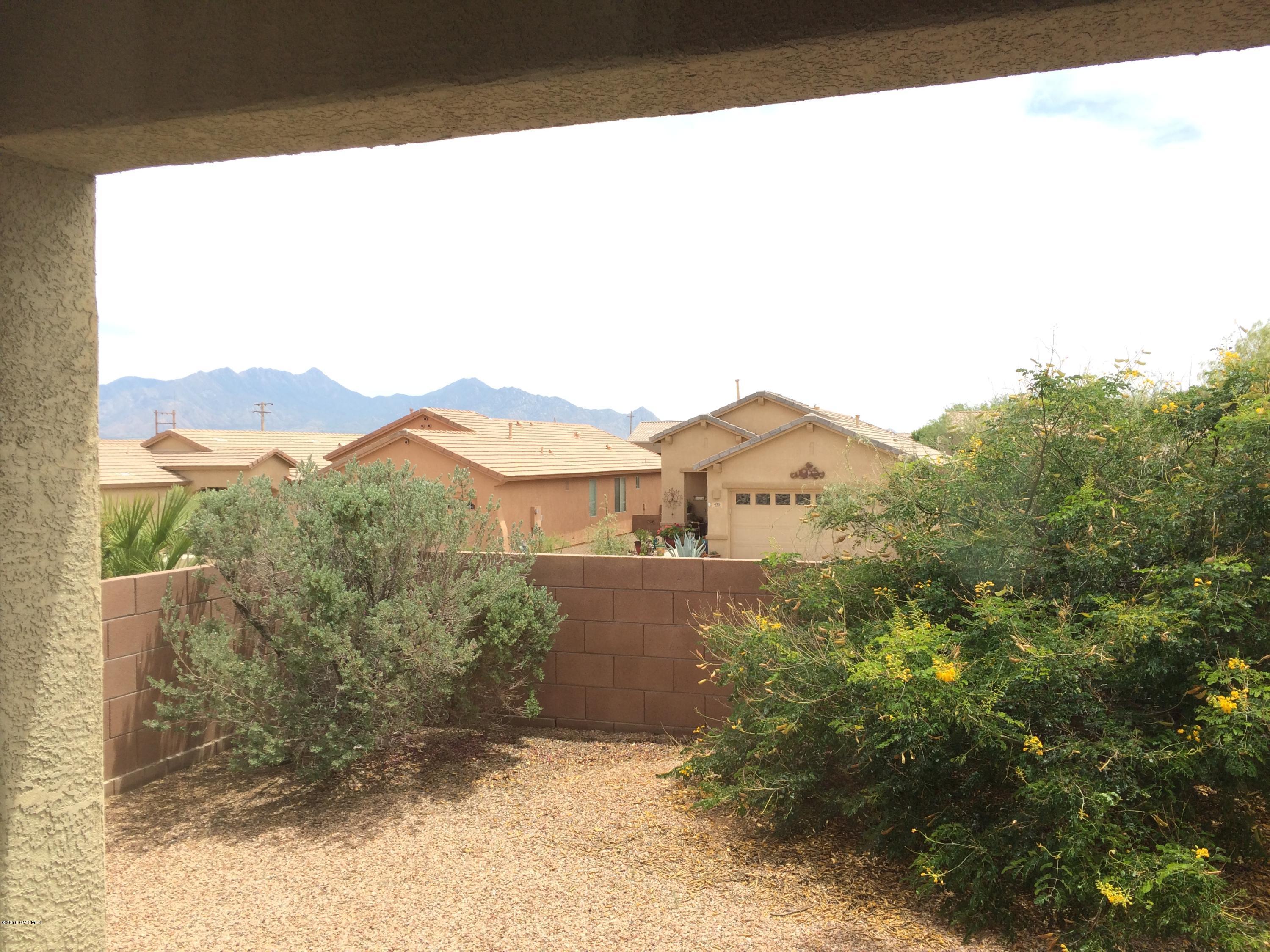 Wonderful newer home in gated community! This home has a stunning mountain view from the back patio area. Fresh designer paint as well as upgrades that everyone will enjoy. Garage was increased in size by 2 feet longer when the home was built. Bay window in master bedroom to enjoy the beautiful mountain views. Soft water loop is installed. Inside has a family room and living room with lots of windows. Open concept living at its finest. Kitchen has a large bar area for easy dining alternatives. Upgraded cabinets thru out the home. Formal dining area can be used as a den or expanded living area. Huge walk-in closet in both bedrooms. Home has barely been used!
