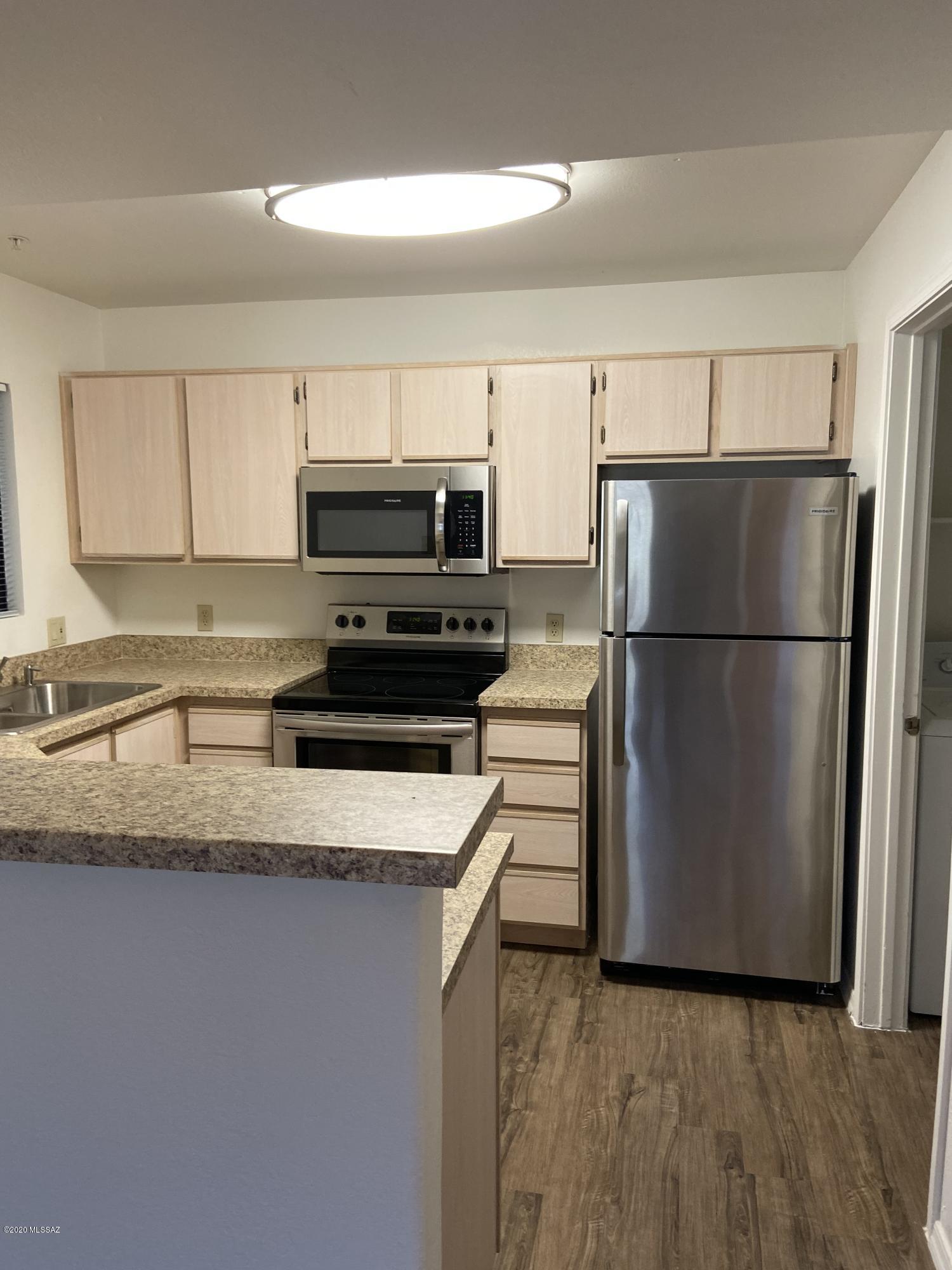 Location, Location, Location!!! A prime corner unit with views and close to all of the community amenities including two resort style pools, clubhouse and fitness center. Very spacious 2 bedroom 2 bath with an open great room floorplan, split bedrooms, Luxury Vinyl Plank throughout, newer countertops. and stainless steel appliances. Loads of storage featuring walk in closets in both bedrooms, 2 linen closets as well as a storage closet off of your private patio. 24-hour gated access community features Close proximity to many restaurants, shopping, banks, hiking, golf +++ Leased through 5/31/2021 for $1,075.00 per month. Lease conveys with purchase.