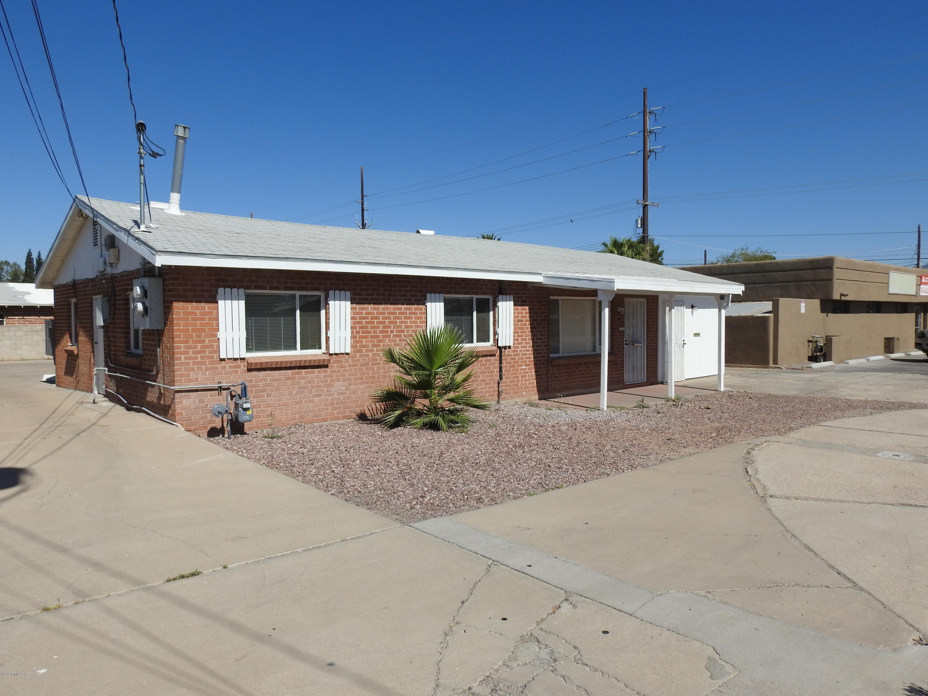 Here is your opportunity to invest in this single story two office suite commercial building, Zoned O-3. The 1053-sf side offers 3 offices, full kitchen, waiting area, gas fireplace, 1 bath, central AC & gas furnace. The 297-sf office is open space with 1 bath with shower, kitchen area with cabinets with wall A/C & heat.  You have parking parking in rear, aluminum fascia, security doors, updated wiring with separate 200  amp electric services and meters for each unit. Seller is willing to consider selling financing with acceptable terms and down payment.  Call for details.