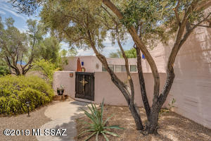 From the moment you enter the front gate into the courtyard pool area you know you are in a very unique home with lots of character.  This is no cookie cutter - your discerning buyer will want to see more.  Saltillo tile throughout and the open floor plan make this the ideal entertainers home.  Sliders all along the living room, dining room, kitchen and master bedroom open to the courtyard pool area letting in lots of natural light.  The see through fireplace from the living room to the family room/guest area add that extra bit of ambiance to make this a truly exceptional property.   The furnishings just add to the unique upscale feel of the home.  Furniture is included except piano which is for sale by separate bill of sale.