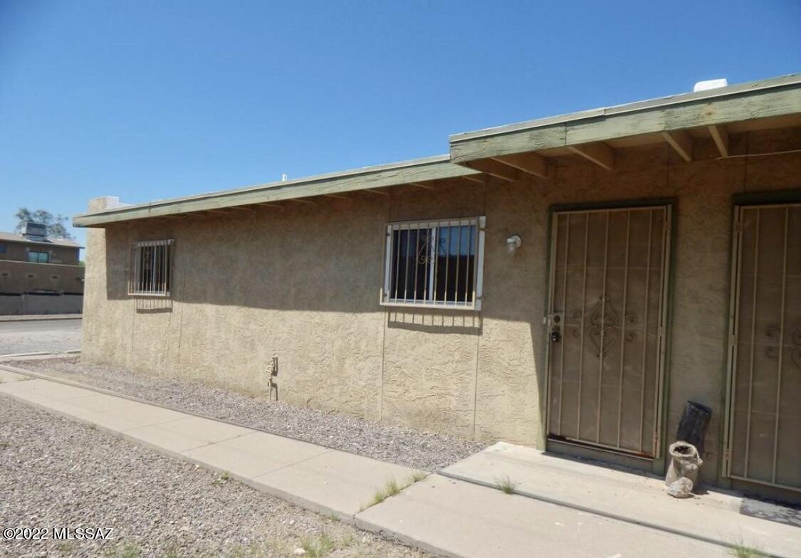 Wonderful duplex, built in the Biltmore re-subdivision!! These updated units feature 864 square feet of living space, two large bedrooms and one bath. Home has an inviting beehive wood burning fireplace, separate dining area, arched retaining wall and many unique touches throughout. Carpet in all living areas and ceramic tile in the kitchen, with ample guest parking (No parking permit needed), washer/dryer included and fenced back yard for pets. Located minutes from the U of A!! Ride your bike to class! Near popular nightlife, shopping, downtown Tucson, historic 4th avenue and plenty of popular dining spots!