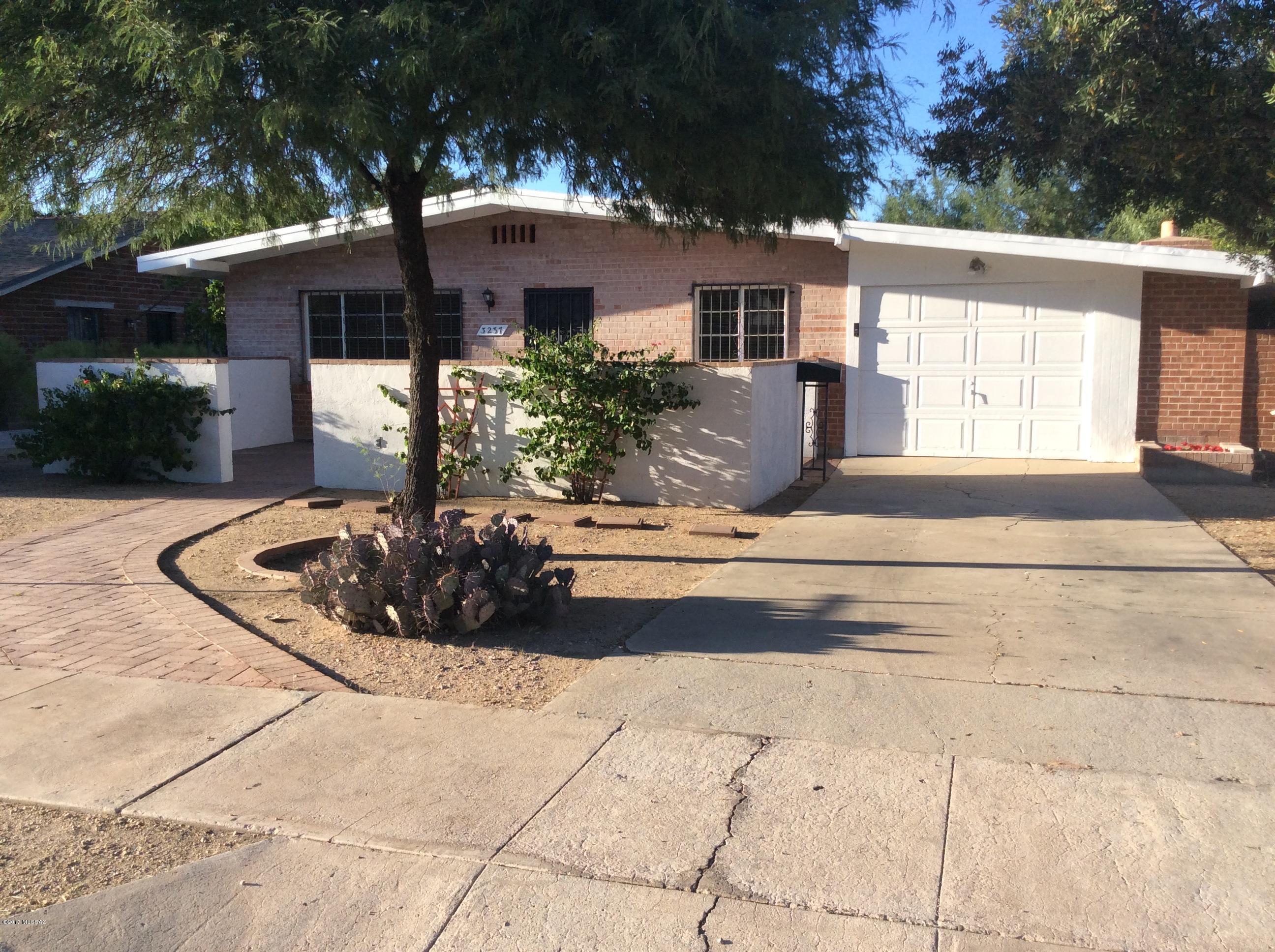 Charming 4 bedroom 2 bath home in the heart of the city! Close to shopping, restaurants, public transit, University of Arizona, and Banner UMC hospital. Home features recently remodeled bathrooms with new vanities and tiled shower surrounds, all tile floors throughout, large fanced backyard, fireplace is master bedroom, and a garage with extra storage. Minutes from the 3rd St bike path to the University! Don't pass this opportunity up!