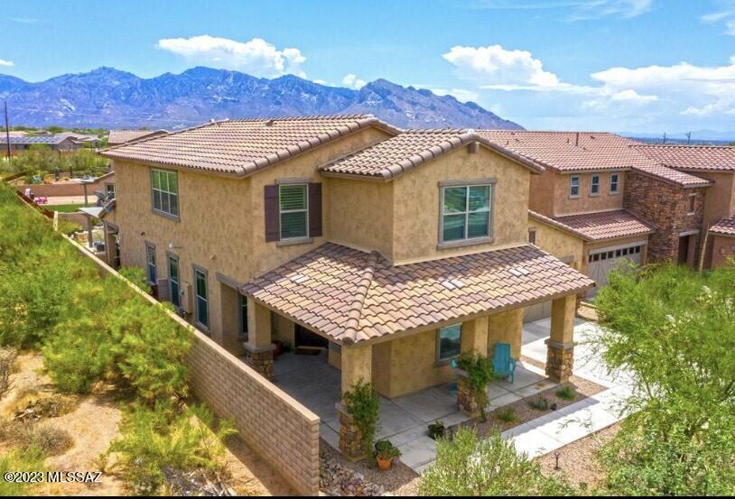 Welcome to your dream home in the heart of Oro Valley, Arizona! This stunning 5-bedroom, 5-bathroom residence is a testament to luxury living, nestled in a serene cul-de-sac within a prestigious gated community. As you approach the home, marvel at the picturesque mountain views that grace the horizon, setting the stage for the breathtaking beauty that awaits within. The architecture is a perfect blend of sophistication and Southwestern charm, seamlessly integrating with the natural surroundings. Be greeted by a spacious and meticulously designed interior. The open floor plan effortlessly connects the living spaces, providing an inviting atmosphere for both entertaining and everyday living. The gourmet kitchen is a chef's delight, featuring high-end appliances granite counters, and a convenient breakfast bar. With an Induction cook top getting dinner going quickly is a breeze, there is also a natural gas connection in place for easy replacement if you prefer. The primary bedroom is a true retreat, offering a private sanctuary with its own ensuite and expansive windows framing the majestic mountain vistas. Each of the remaining four bedrooms is generously sized, providing comfort and privacy for family and guests. Venture outdoors to the backyard oasis, where relaxation and entertainment seamlessly blend. The spool (combination spa and pool) invites you to unwind in style, while the built-in BBQ area is perfect for hosting gatherings with friends and family. Enjoy the lush greenery of the turf, providing a low-maintenance and visually appealing landscape. A pergola adds a touch of elegance, offering a shaded retreat to savor the stunning mountain views. What sets this home apart is its unique bordering of State land, ensuring privacy and a connection to the natural beauty of the surrounding desert landscape. This is not just a residence; it's a gateway to the great outdoors, with hiking trails and nature at your doorstep. Experience the epitome of Arizona living in this Oro Valley gem. With its combination of luxurious features, breathtaking views, and a prime location, this home truly offers a lifestyle of unparalleled comfort and sophistication. Welcome to your new haven in the Arizona sun! New A/C unit installed in 06/2023