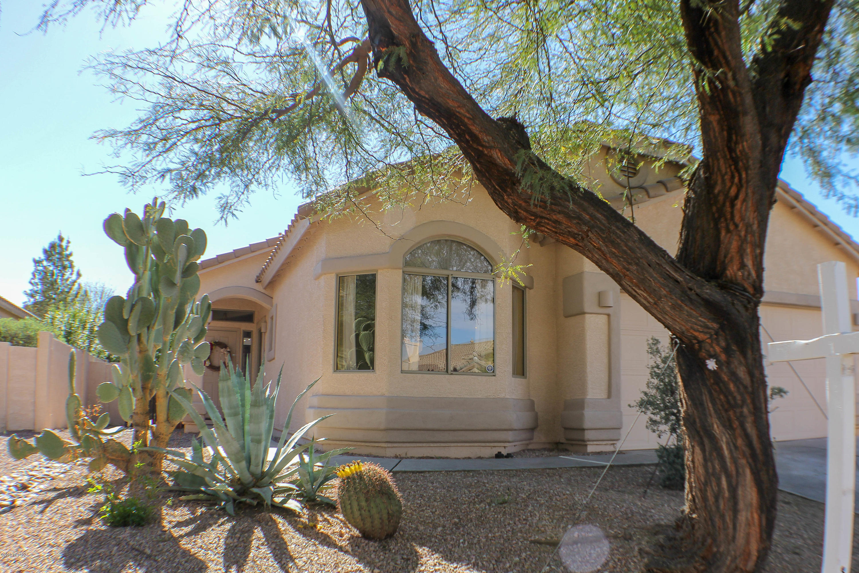Well designed open floorplan with great room, split bedroom plan.  Den has been converted to 4th bedroom.  All floors are new wood plank (look) tile thru out.  A/C unit was replaced approx. 1 year ago.  Backyard has been fully landscaped and with the covered patio it lends well to the outdoor lifestyle of Arizona living.  This home is close to the lake and close to the park.  Easy access to I-19.