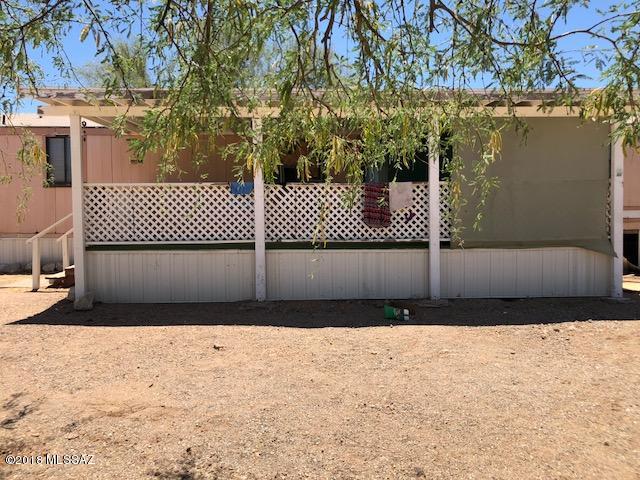 Almost an acre! .98 Property with a single-wide manufactured home and all utilities on lot. Great property & a great price! lots of space desert vegetation, large tree in the back.