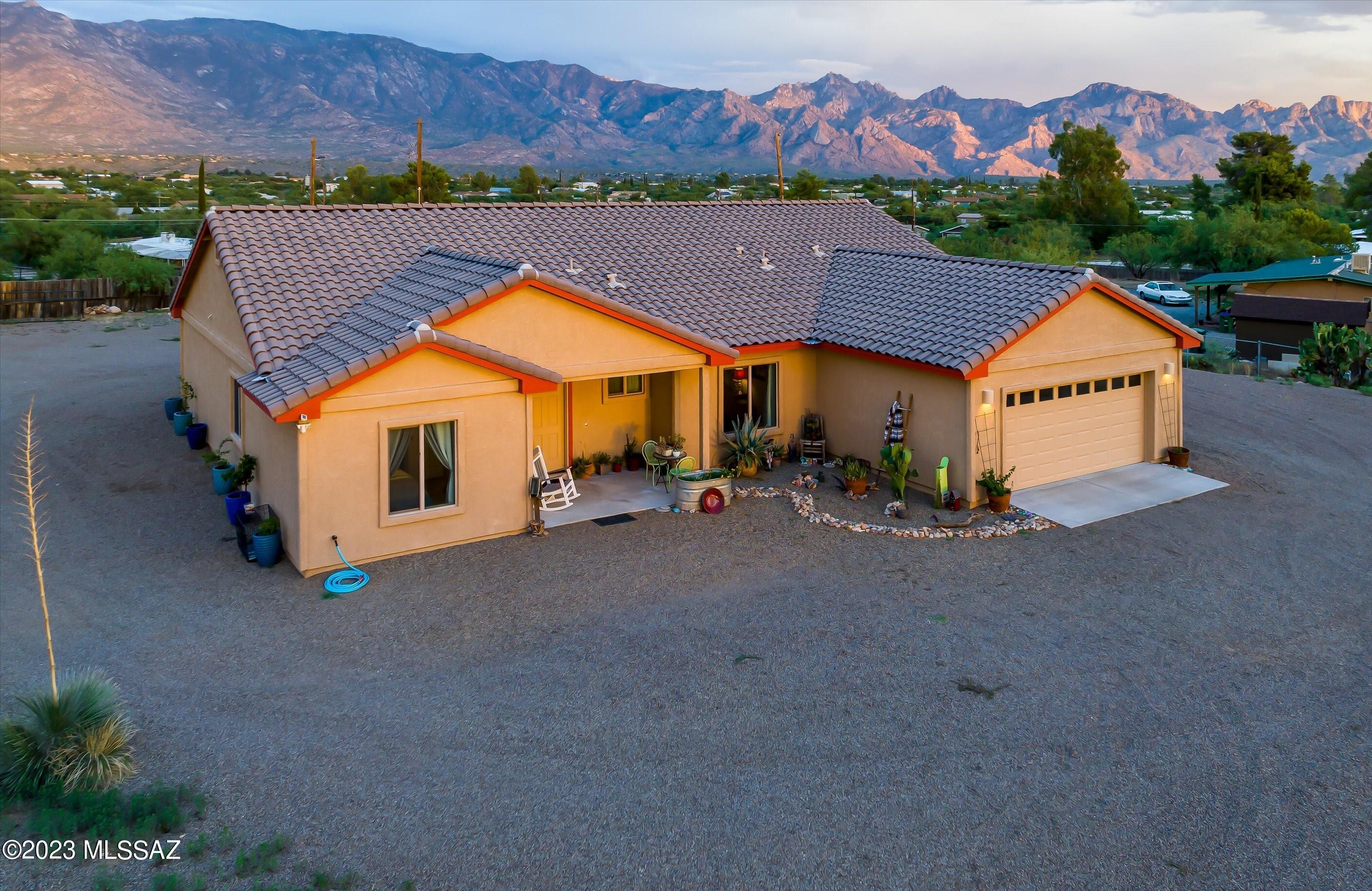 Nearly-new home built in 2020 on 1.09 acres, with panoramic views of both the Catalina and Tortolita mountains! Clean and meticulously maintained, with 3-bedrooms and 2.5 bathrooms and an additional office that could be used as a 4th bedroom. The light and airy open concept floor plan features great views from every window, while the kitchen has plenty of room for entertaining at the bar height countertop. The primary suite features a walk-in closet, soaking tub, and separate standing shower. Enjoy monsoon storms from the east-facing covered patio, accessed through glass faced French doors. The large useable lot features a shed on a concrete slab, along with enough space for horse facilities, gardening, a workshop, or parking toys. No HOA!