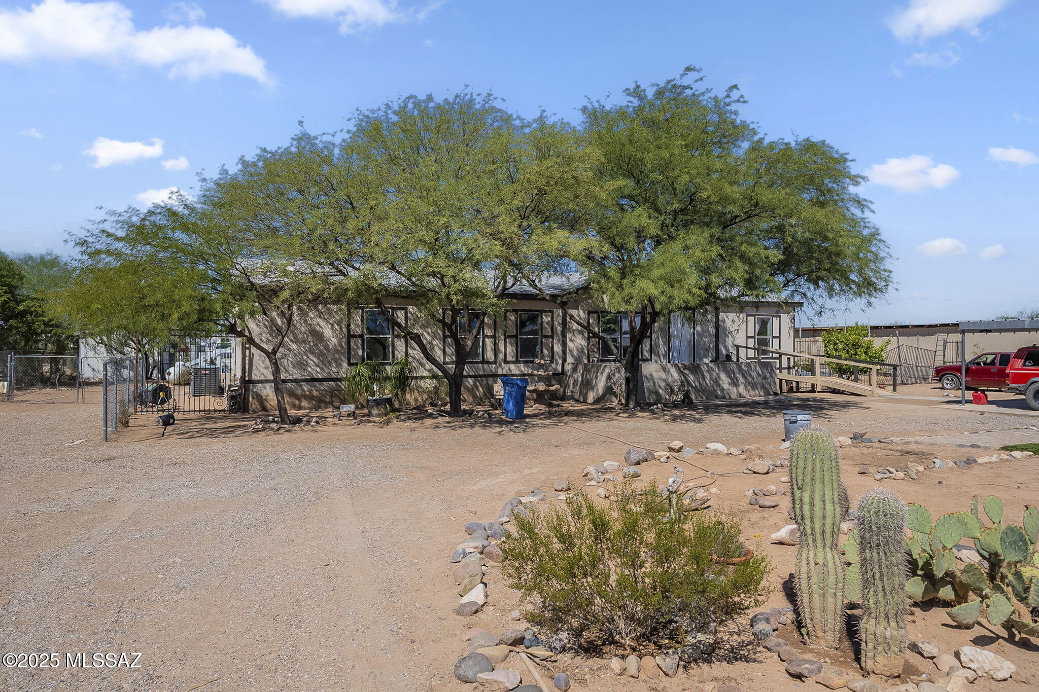 This is a range list pricing from 280000 to 295000. Beautiful manufactured home on an acre lot with manicured landscaping and irrigation systems. There is a gorgeous view  of the mountains, and it is positioned very close to the I-10 for convenient access and centrally located in Vail. There are well maintained dirt roads, and a lot of spaces between the homes. Plenty of space to place an RV, cars, or anything you can imagine. Enjoy the freedom of this property. Motivated Seller