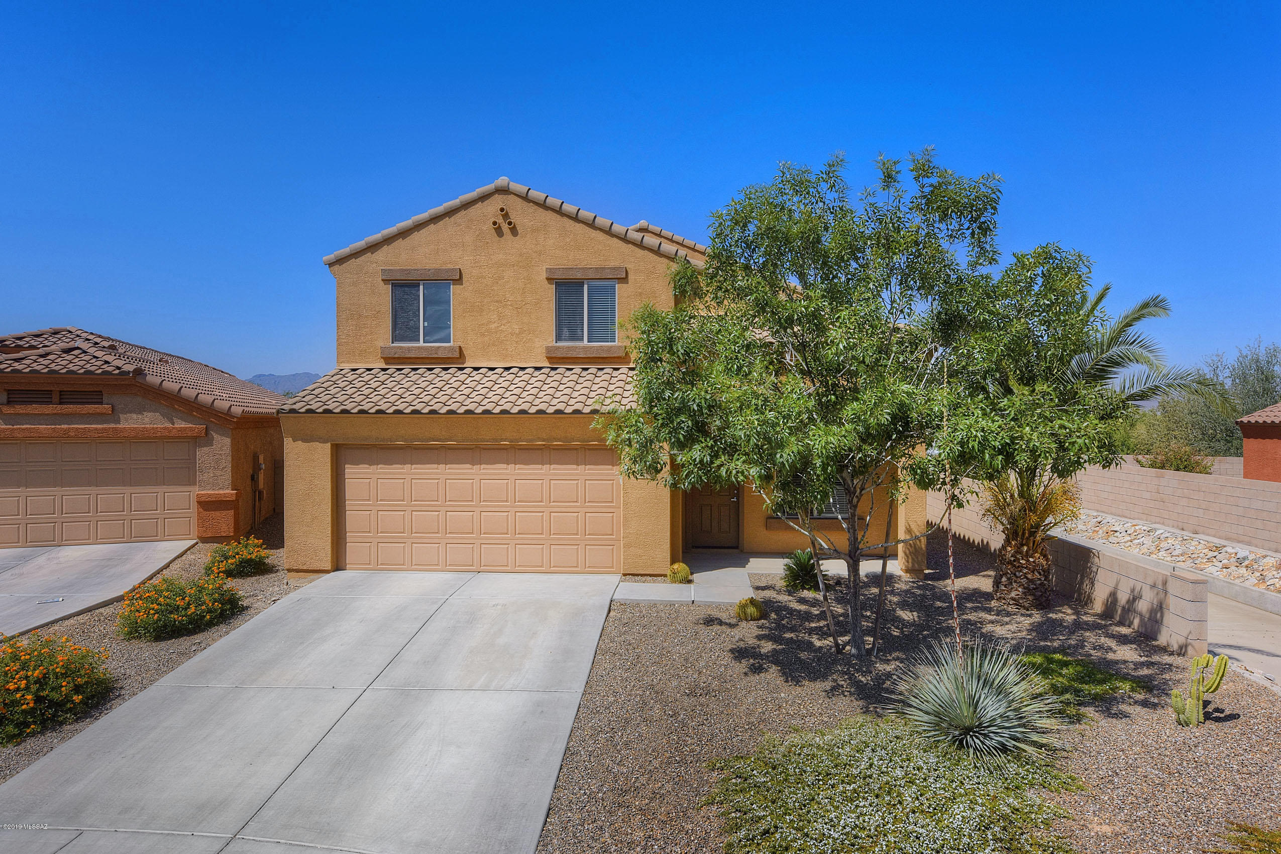 Our 3 bedroom 2.5 bath beautiful home affords you the opportunity of quiet living in a convenient location within minutes of I-10. Our kitchen boats of granite counter tops, stainless steel appliances and beautiful cabinets. Our open floor plan from the kitchen looks over a breakfast island bar into a spacious family room. Our second living / dining space under cathedral height ceilings, maintains a stately feel when entering the home. Our over-sized master bedroom suite boasts double vanity, walk in closet and spectacular sunset views. No rear neighbors, full rear covered patio to keep cool. Extra-wide lot with citrus trees, and mountain views. The large back yard affords you the opportunity to have a wonderful pool and desert oasis installed without sacrificing space.