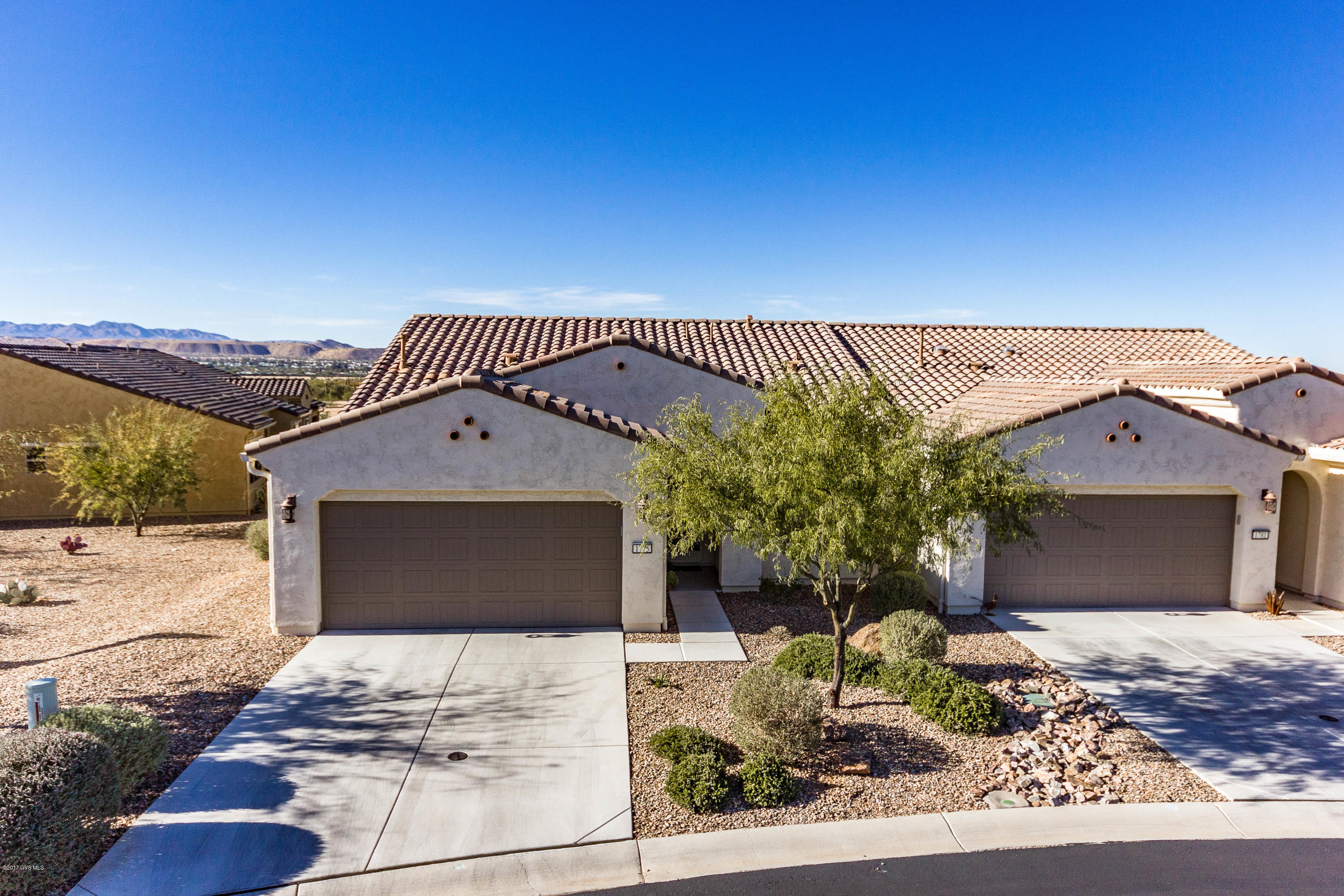 Why wait almost a year to build when you can move in tomorrow? This popular Lock N' Leave Sagebrush 2 BR/2BA Villa is the perfect vacation home. Compact and efficient, there isn't an inch of wasted space. Less time spent cleaning, means more time to enjoy all that Quail Creek has to offer. No worries about landscaping, exterior maintenance, or pest control. With almost $35k in upgrades, a private lot with common area on two sides and a mountain view, this 1286 sq ft Quail Creek home is picture- perfect. The kitchen has Quartz counters, under-cabinet lighting, GE Energy Star s/s appliances, tile backsplash, a granite under-mount sink plus much more. Windows are Suncoat Max Low-E, and the back patio has extended pavers, roller shades. You'll love the designer touches of the  decorative lighting and fan fixtures and the built-in wine rack. Garage cabinets provide extra storage. The Master bedroom has an en-suite bathroom with walk-in closet, shower and dual sinks. The guest room can be used as a den or second bedroom. Washer and dryer hide in their own laundry closet. Enjoy the Quail Creek lifestyle in your own Villa with friendly neighbors all around.