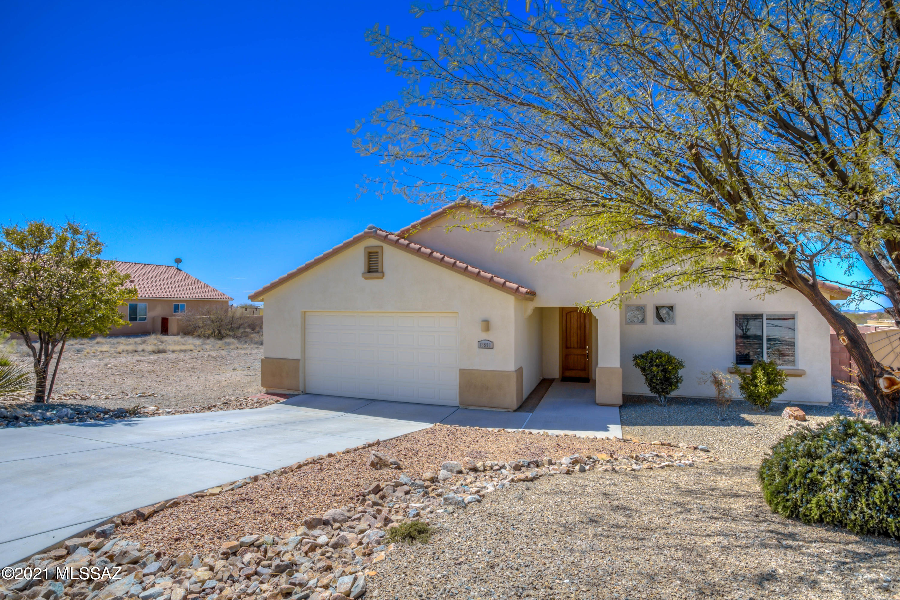 Beautiful Spacious home on an almost 1 acre lot located in a small quiet neighborhood! You'll love the great room floorplan, split bedrooms and spacious feel. The open kitchen has a large island and breakfast bar, lots of cabinets for storage and stylish granite and backsplash. Kitchen appliances, carpeting and LVP flooring are all just over 1 yr old! This home is super clean and ready for your move-in!  Enjoy majestic mountain views and gorgeous  AZ sunsets from the huge backyard! Where there is room for a pool and all your outdoor toys! In the Award winning Vail school district. Close to I10 and Shopping! 1 year 2-10 Home Warranty plan included. This home is a must see!