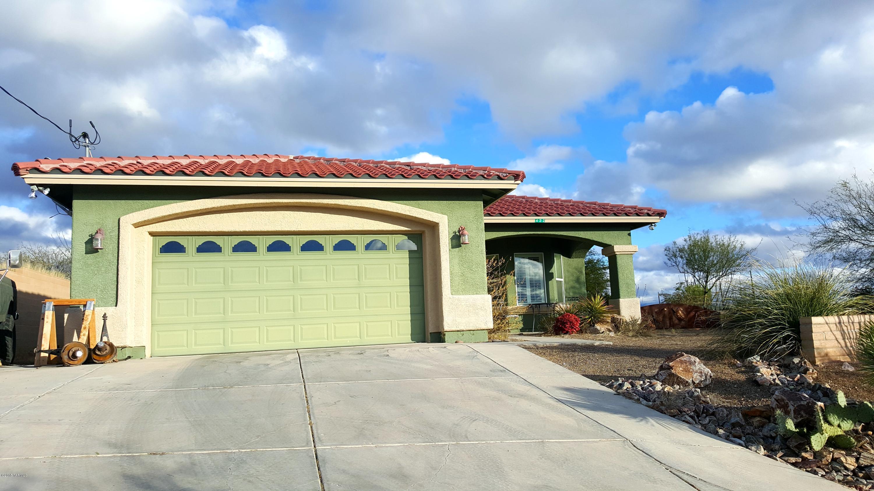 Stunning 360 degree panoramic mountain views! Charming and bright 4 bedroom/2 bathroom home sitting on over 1 acre! Large kitchen with open concept to dining area and family room. Beautiful plantation shutters throughout home. Backyard is nicely groomed with green grass, gazebo, and large shed for storage. Easy access to I-19.Come see this home today and fall in love!