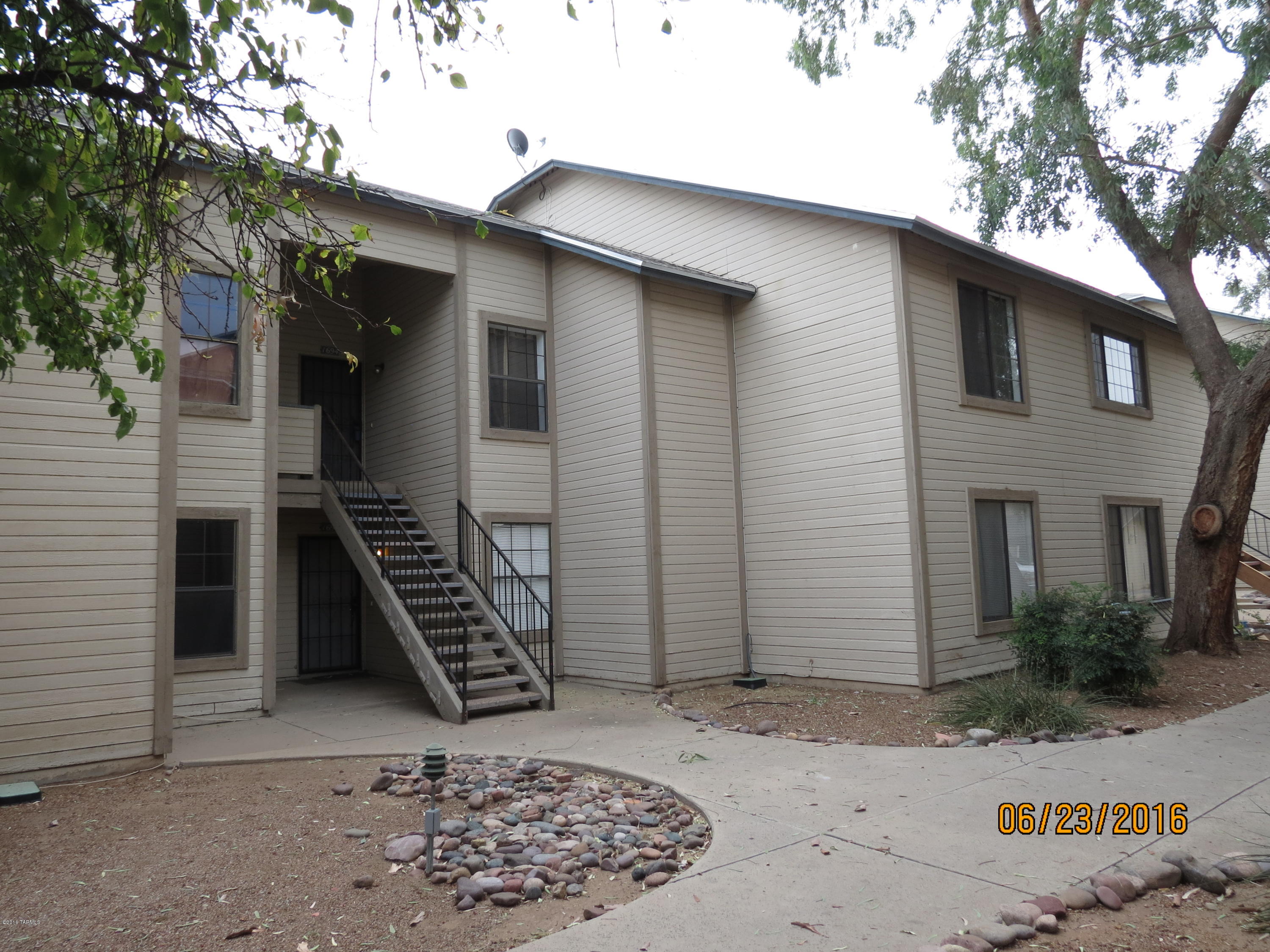 THIS CONDO IS EASY ON THE POCKETBOOK! Just plain nice! This airy & open floor-unit has park-like surroundings, near schools. New flooring, fresh interior paint, big bedrooms, walk-in closet, dramatic vaulted ceilings with A/C & heat pump. Cozy dine-in kitchen with built-in microwave. Fireside cheer in greatroom. Immediately available. HOA covers termites, roof, water, sewer, trash, and all common areas.