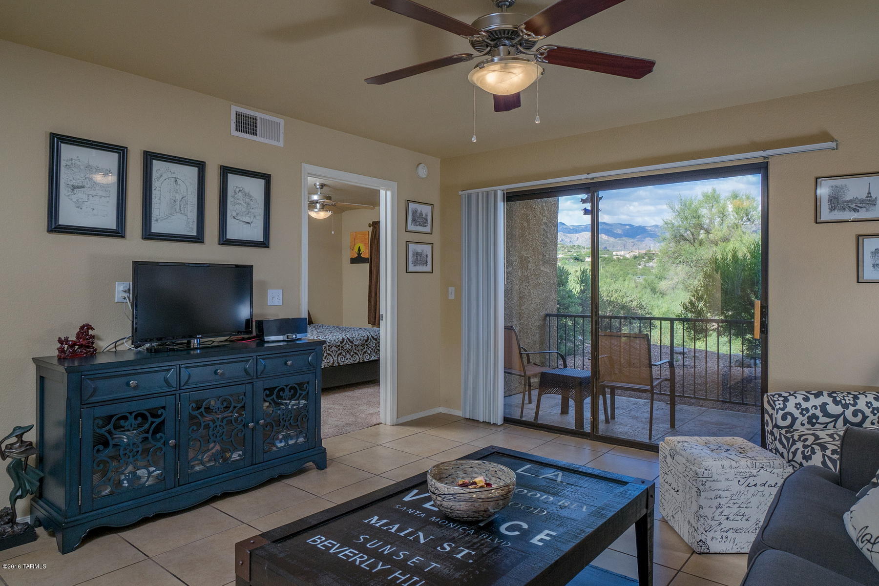 Private renovated ground floor condo with amazing Catalina Mountain view in the gated Northern Tucson community of The Villas At Sabino Canyon.  This spacious Catalina Foothills condo features ceramic tile flooring everywhere except bedrooms, East facing covered patio with breathtaking views, split bedrooms, romantic wood burning fireplace, kitchen with custom cabinets, granite counters and stainless steel appliances, ceiling fans in both bedrooms and resort style homeowners association amenities.  The Villas At Sabino Canyon include a heated pool & spa, exercise facility, park-like grounds and a convenient location near shopping, restaurants and Sabino Canyon Park.