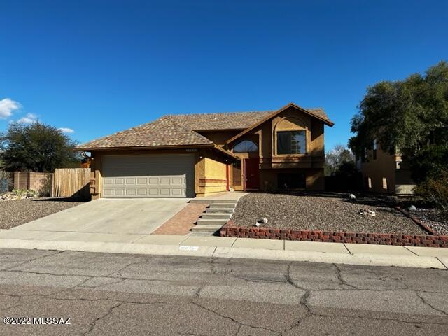 Split -level home on premium lot that backs up to the lush desert with magnificent mountain views.  Split level lower level has the primary suite, one other bedroom, a bath, laundry room and family/multipurpose room.  The primary bath features a walk-in closet plus a separate tub & shower.  Upper level has 1/2 bath, living room, dining area, updated kitchen with a spacious pantry and lovely mountain views from the kitchen window. There are 2 additional bedrooms that share a Jack and Jill bathroom and several walk-in closets.   The house has a covered patio and faces east.  Nice views of the desert and gorgeous views of the mountains!  Plus there is room to park your trailer or RV. One Seller is licensed to sell real estate in Arizona.