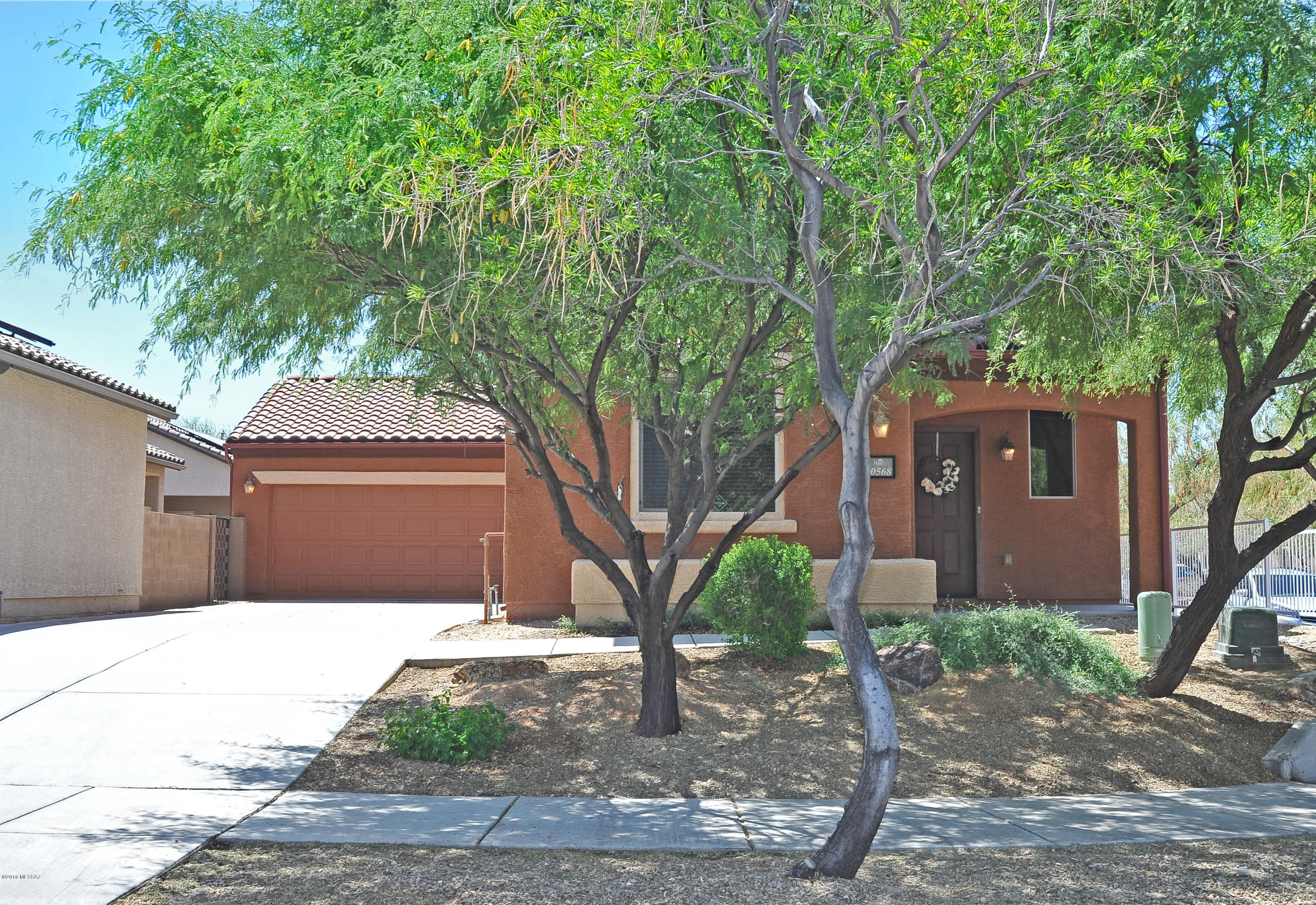 Shows like a model. This home is a must see with generous upgrades throughout! 4bd & 3ba with 1 bedroom & full bathroom downstairs. Chef's kitchen w/ new professional grade appliances such as the gas range, super quiet dishwasher and refrigerator is included! Slab granite counter tops in kitchen with maple cabinets and large eat-at island. Installed high tech video surveillance camera system plus 4 additional cameras for expansion & TV screen for monitoring. CAT-5, surround sound and wired for additional speakers. Backyard is low care with an expanded stamped concrete patio, raised flower beds and 2 gas (BBQ & fire-pit) stubs. Extra long driveway allows for plenty of space to park extra cars. Live life at Sierra Morado & enjoy the community pool, parks (dog park too) rec center and more!
