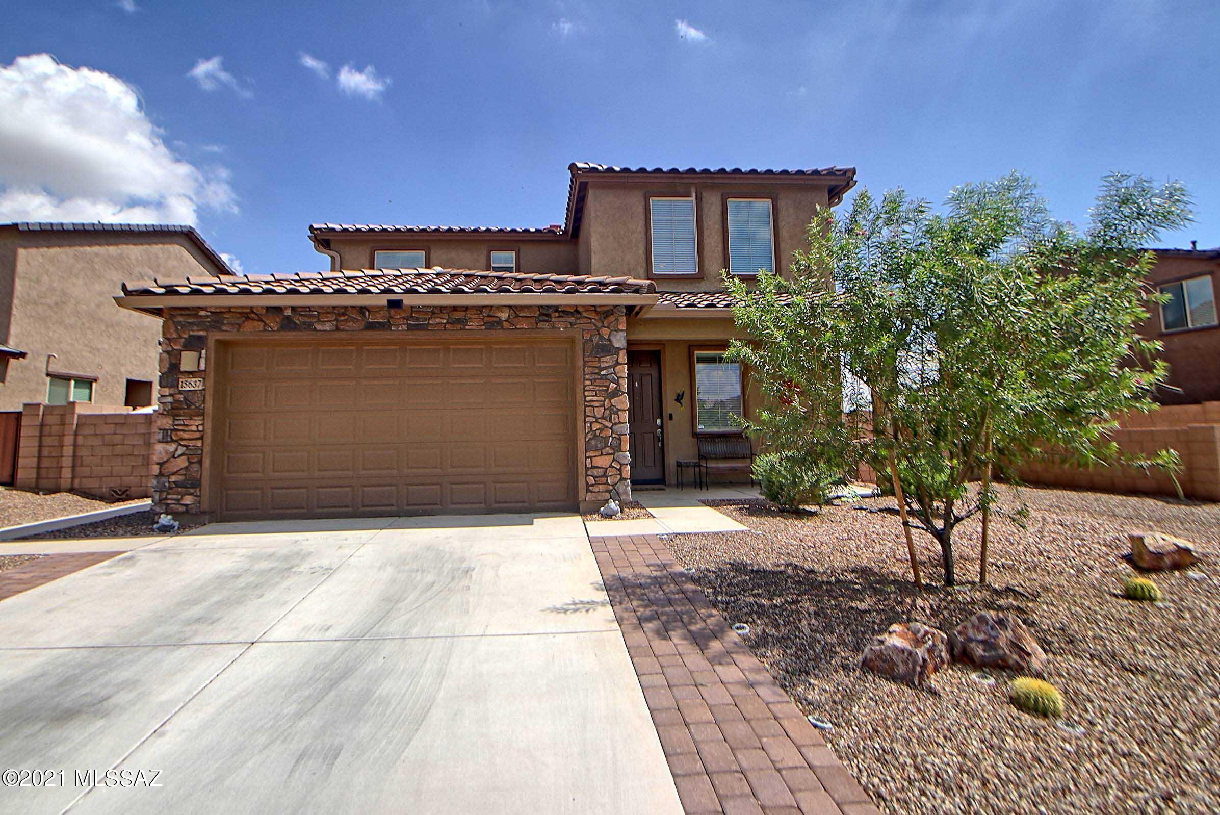 Look no further because this exceptional home is the one for you! This magnificent 2 story home built in 2020 is located in the NEW desirable neighborhood of Entrada Del Rio. At 2,897 sq ft, you have 5 bedrooms, 4 baths, and a 2 car garage. This sought after design offers a Next Generation floor plan with it's own private suite including a living area, full bathroom, kitchen, and bedroom. The first floor w/ 9'' ceilings is an open concept allowing you to encompass the kitchen, dining area, and living room all at once. Enjoy having company while showcasing your grand kitchen that comes with an enormous island, breakfast bar, stainless steel appliances, and fresh backsplash. The entire house utilizes granite countertops in both of its kitchens and all of the bathrooms. You will find beautiful grey ceramic tile throughout the first floor and matching laminate flooring on the second floor w/ 8" ceilings. The interior layout is designed for entertaining with 4 out of the 5 bedrooms located upstairs including the spacious master bedroom! A tastefully remodeled master bath offers granite dual vanity countertops, a rainfall walk-in shower, and a walk-in closet. The 3 secondary bedrooms and loft area create space to utilize as an office or guest bedrooms. Enter into a beautiful backyard that is tastefully landscaped with a screened/covered patio. Outside you find travertine flooring, artificial grass (25 yr warranty), ultra modern freshwater pool and spa, and an outdoor kitchen with a Delta Heat grill, Delta Heat side burner, and a FireMagic sink and fridge. The pool includes a Pentair control system that allows you to heat and light up the pool with your phone! This home comes with all the modern upgrades including: Culligan water softener/purifying system, 40 gallon water heater, all new ceiling fans, Lutron lighting system w/ remote controlled lighting, outdoor Defiant daylight digital timer lights, Honeywell thermostat system, MyQ garage door opener, Ring doorbell security system, Schlage smart lock system, Ruckus wireless system, and GE app controlled washer/dryer and oven appliances. Located in the center of Rancho Sahuarita it is close to community parks, walking trails, shopping, restaurants, the clubhouse, Northwest hospital and even I19. This house is ready to move in so don't wait any longer!