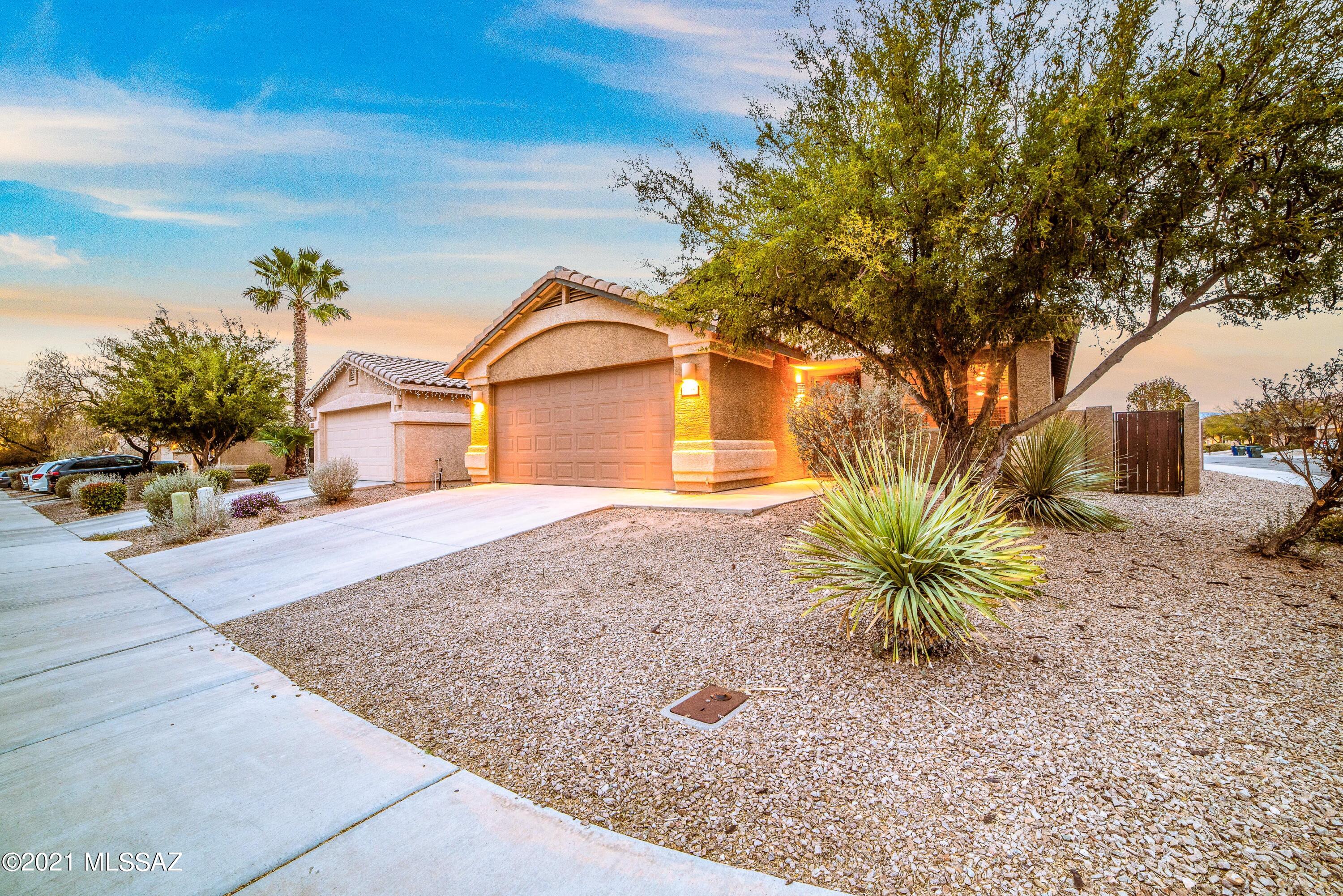 DID YOU SAY SYCAMORE PARK? Excellent location near Davis Monthan, I-10 and the new Amazon warehouse.  Inside, features 2 living areas, vaulted ceilings and if that's not enough. The backyard is to DIE FOR!  fireplace and outdoor built in BBQ with island and seating, perfect for entertaining! 
 Sycamore Park features wonderful amenities- a park with basketball court, jogging/walking path, soccer field, BBQ with Ramada.