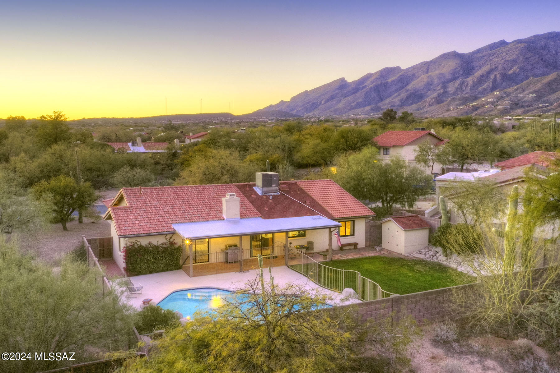 Stunning soft contemporary on a beautiful secluded homesite w/majestic mountain views in the Catalina Foothills. A front brick courtyard & tiled foyer entry invites you into this exceptional well maintained home, exquisite living room & dining area, large picture windows, light & open island kitchen w/ granite countertops, stainless steel appliances, pantry, lovely breakfast area, family room w/high vaulted ceilings, fireplace, 3 bedrooms(split plan), including master w/sitting area, bath w/double sinks, garden tub, large shower, walk in closet & private entry to the rear patio, laundry room & oversized 2 car garage w/ storage room. Enjoy the incredible backyard w/ covered patio, fenced pool, large grass area, lush landscaping, storage shed, Dist. 16 schools & majestic mountain views.